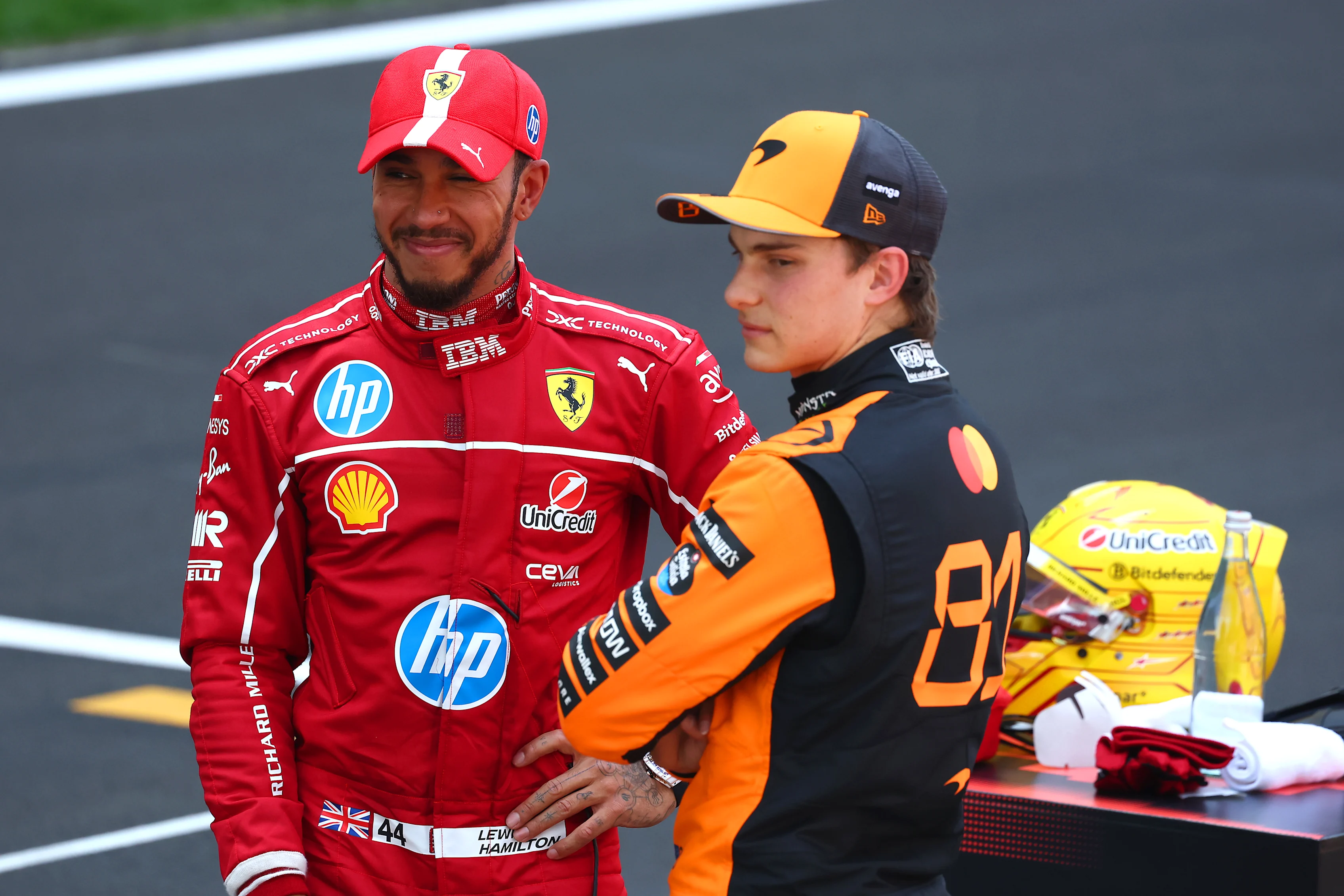 Sprint winner Lewis Hamilton and Oscar Piastri talk in parc ferme  during the Sprint ahead of the F1 Grand Prix of China at Shanghai International Circuit on March 22, 2025 in Shanghai, China. (Photo by Clive Rose/Getty Images)