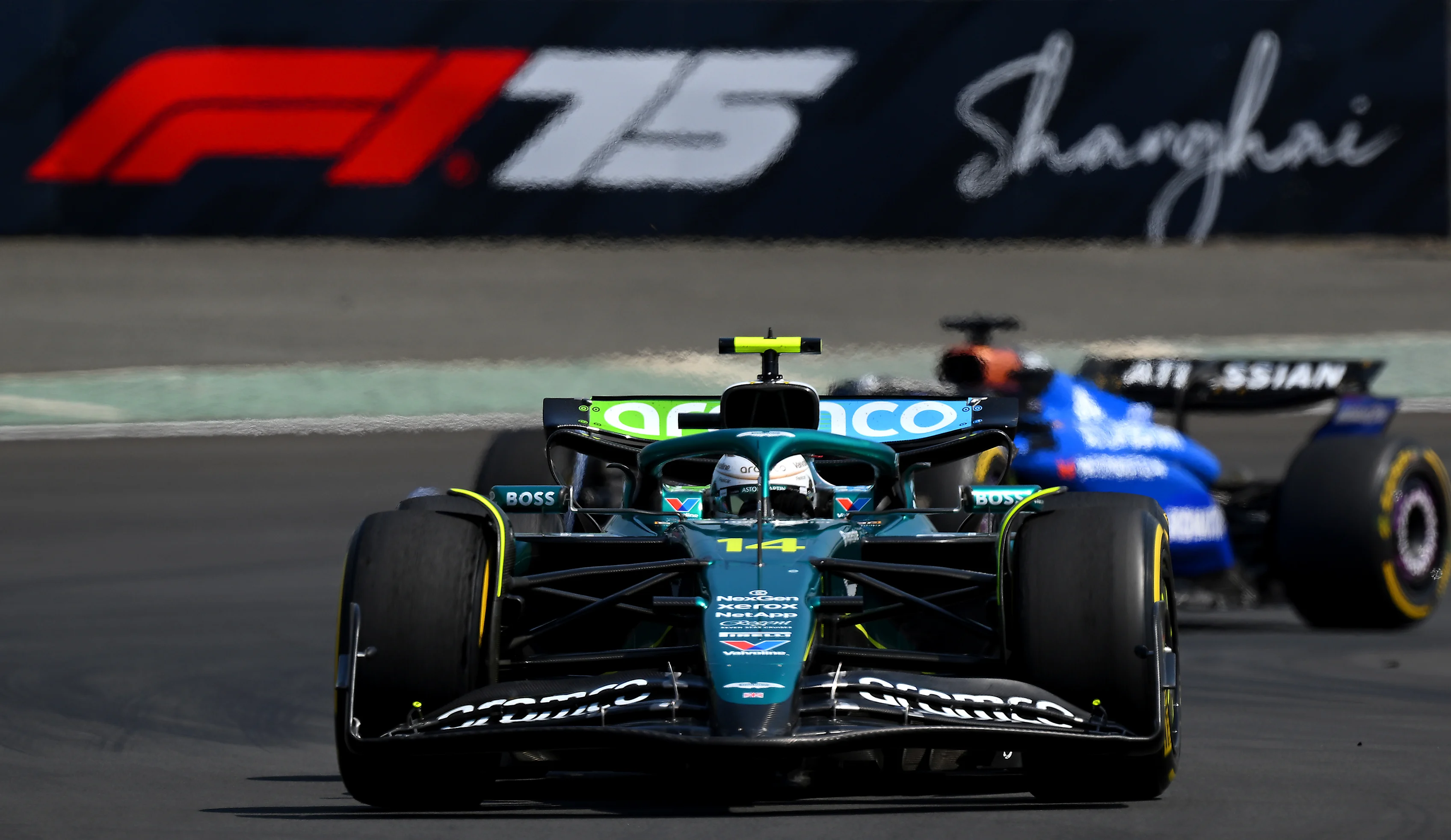 SHANGHAI, CHINA - MARCH 22: Fernando Alonso of Spain driving the (14) Aston Martin F1 Team AMR25 Mercedes leads Alexander Albon of Thailand driving the (23) Williams FW47 Mercedes on track during the Sprint ahead of the F1 Grand Prix of China at Shanghai International Circuit on March 22, 2025 in Shanghai, China. (Photo by Clive Mason/Getty Images)