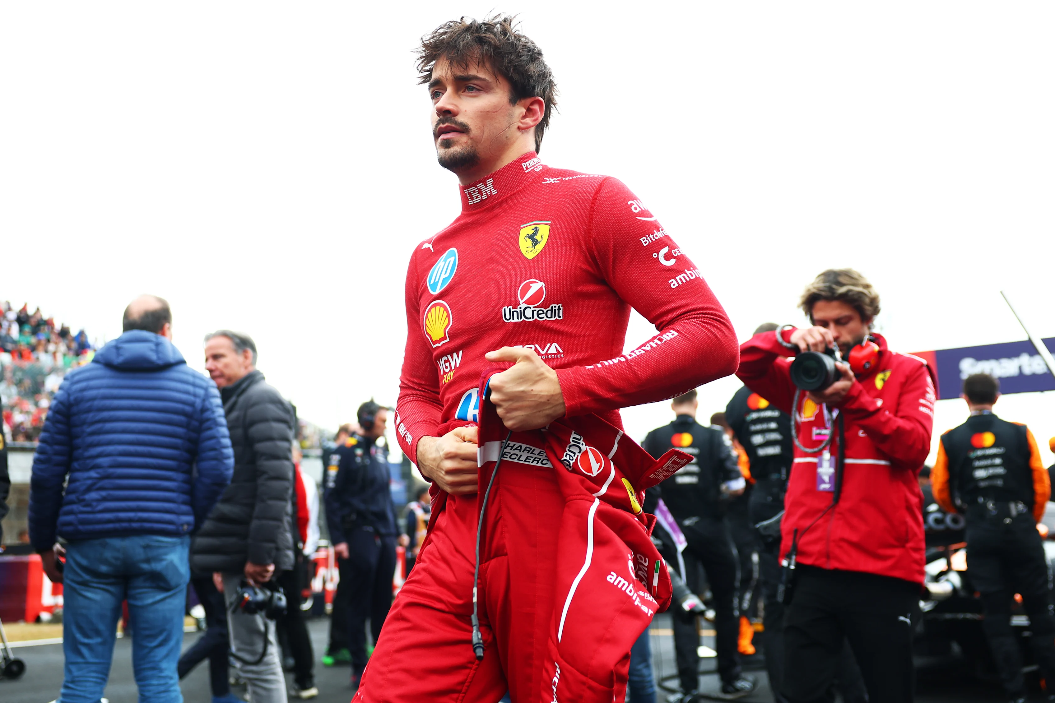 SUZUKA, JAPAN - APRIL 06: Charles Leclerc of Monaco and Scuderia Ferrari looks on on the grid