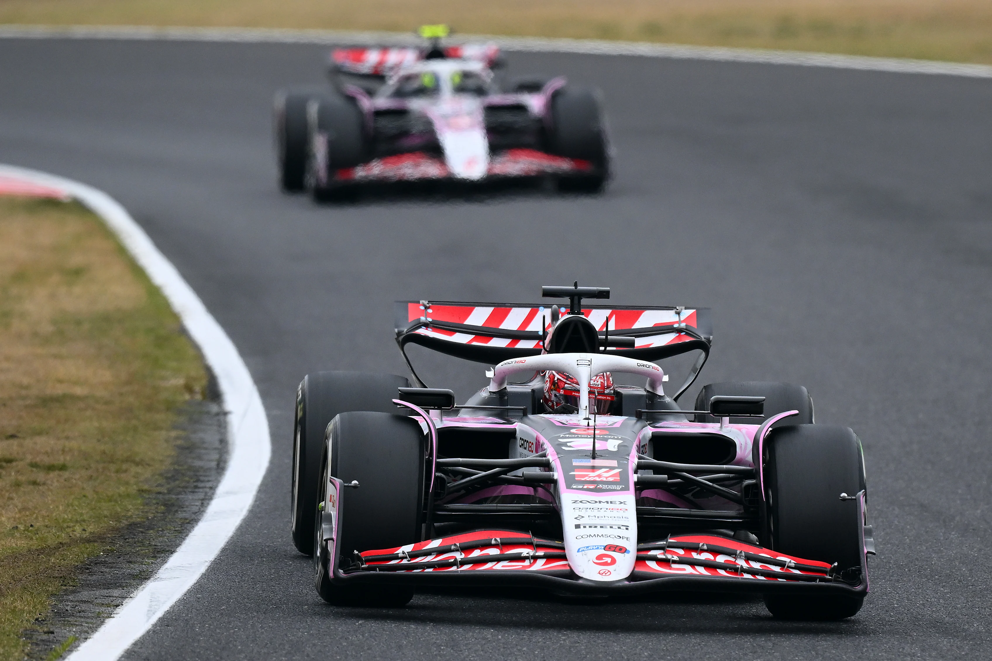 SUZUKA, JAPAN - APRIL 06: Esteban Ocon of France driving the (31) Haas F1 VF-25 Ferrari leads
