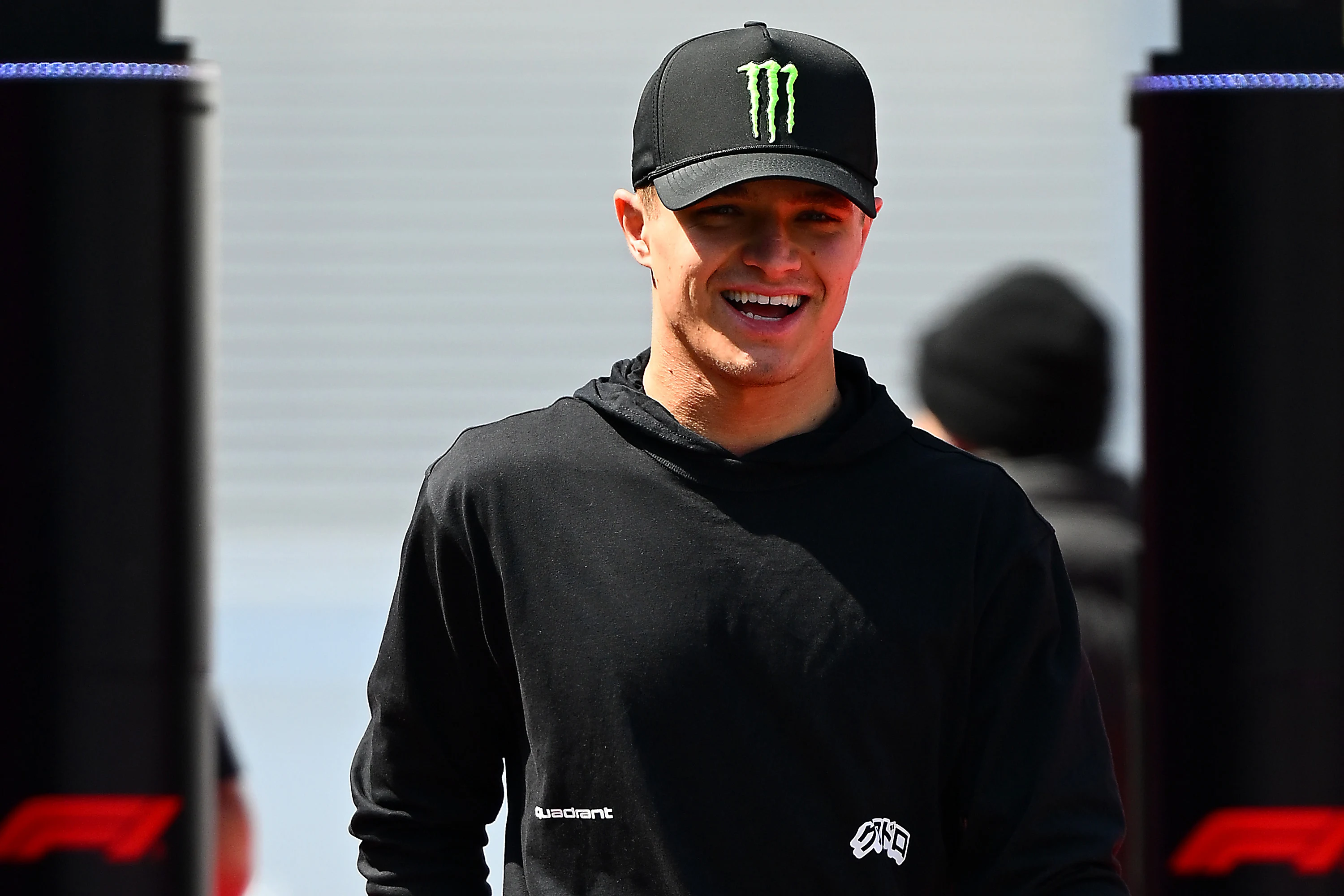 SUZUKA, JAPAN - APRIL 03: Lando Norris of Great Britain and McLaren looks on in the Paddock during