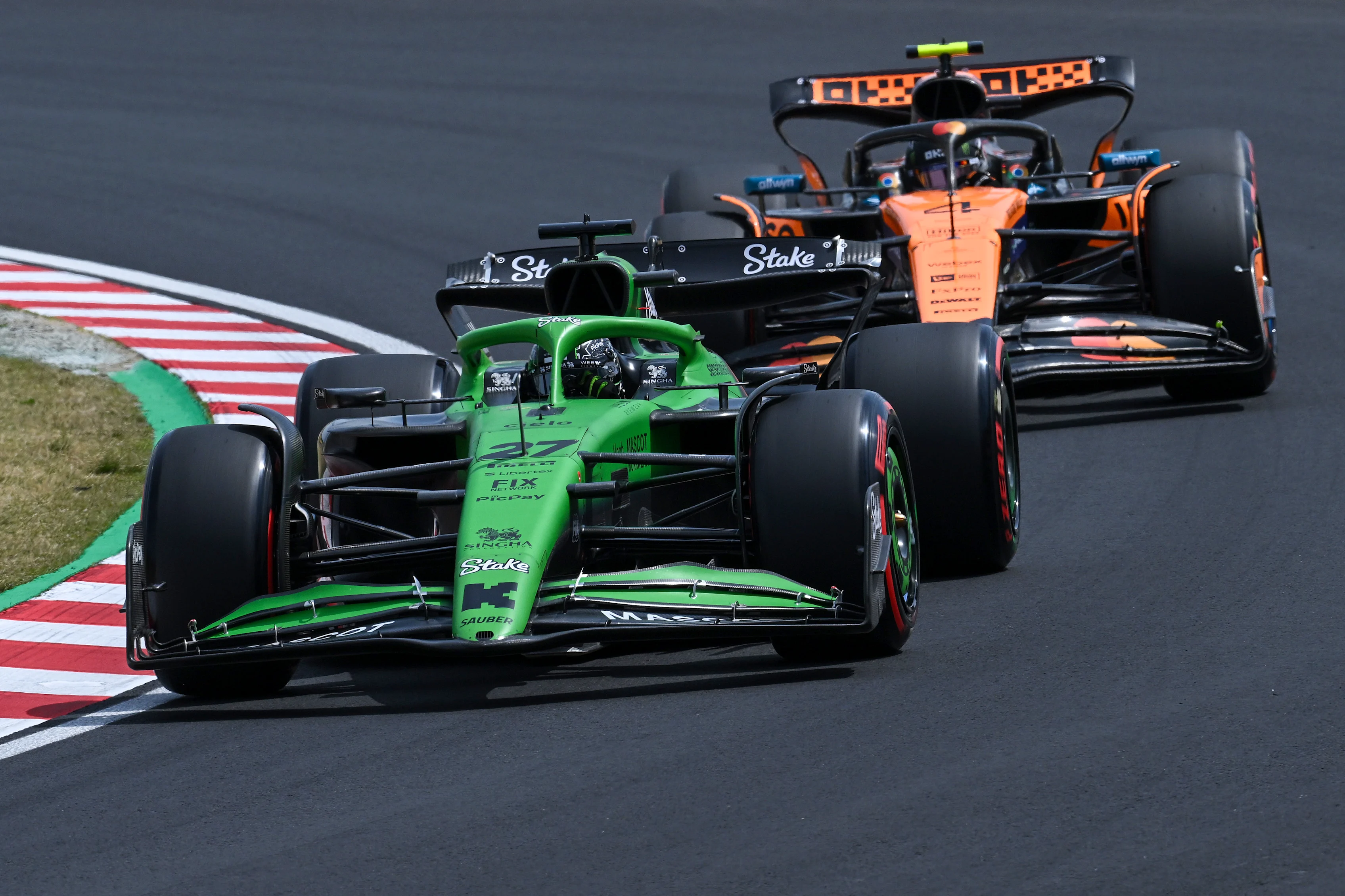 SUZUKA, JAPAN - APRIL 05: Nico Hulkenberg of Germany driving the (27) Kick Sauber C45 Ferrari leads Lando Norris of Great Britain driving the (4) McLaren MCL39 Mercedes on track during final practice ahead of the F1 Grand Prix of Japan at Suzuka Circuit on April 05, 2025 in Suzuka, Japan. (Photo by Mark Sutton - Formula 1/Formula 1 via Getty Images)
