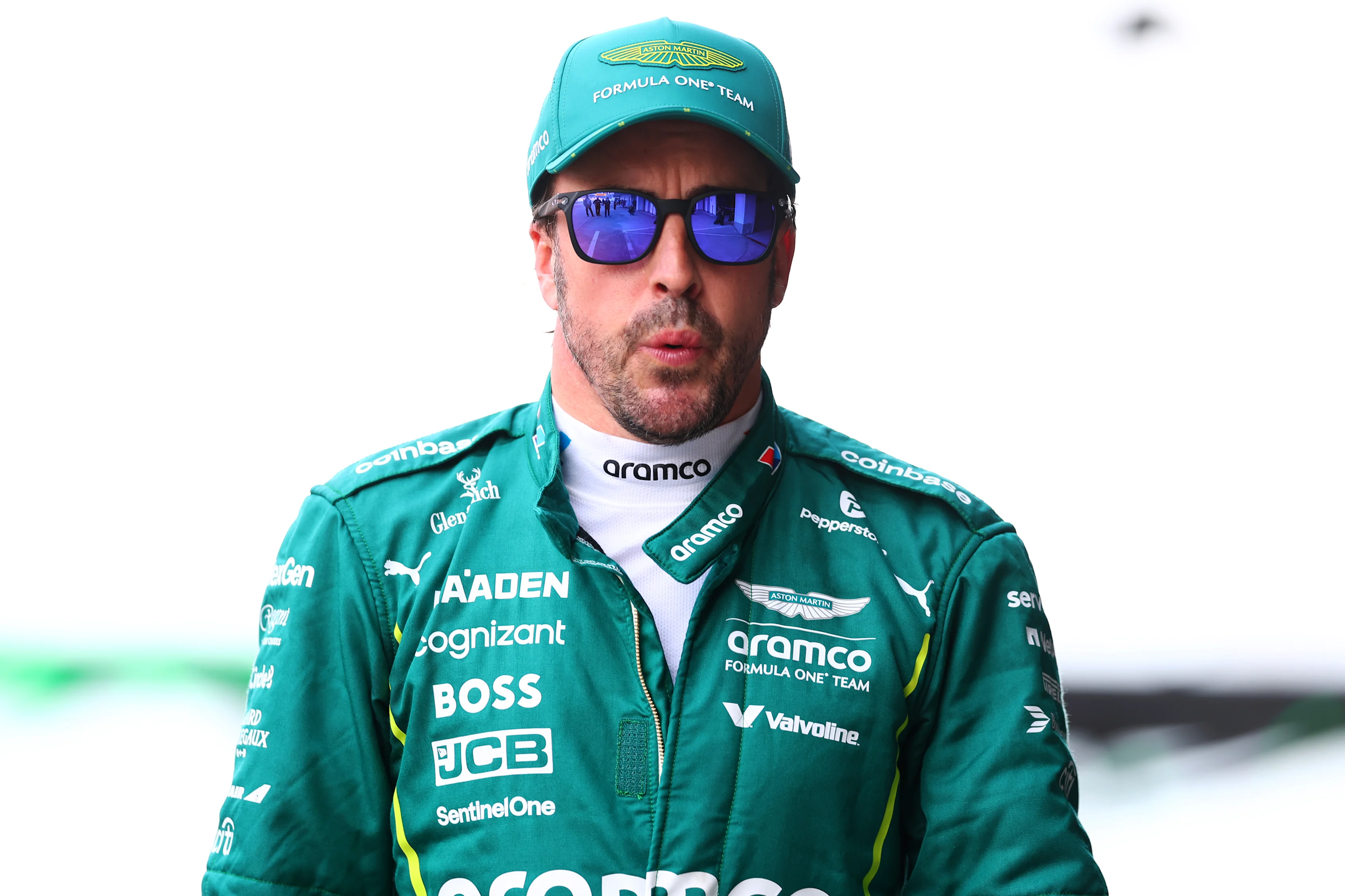 SUZUKA, JAPAN - APRIL 05: Thirteenth placed qualifier Fernando Alonso of Spain and Aston Martin F1 Team looks on in the Pitlane during qualifying ahead of the F1 Grand Prix of Japan at Suzuka Circuit on April 05, 2025 in Suzuka, Japan. (Photo by Bryn Lennon - Formula 1/Formula 1 via Getty Images)