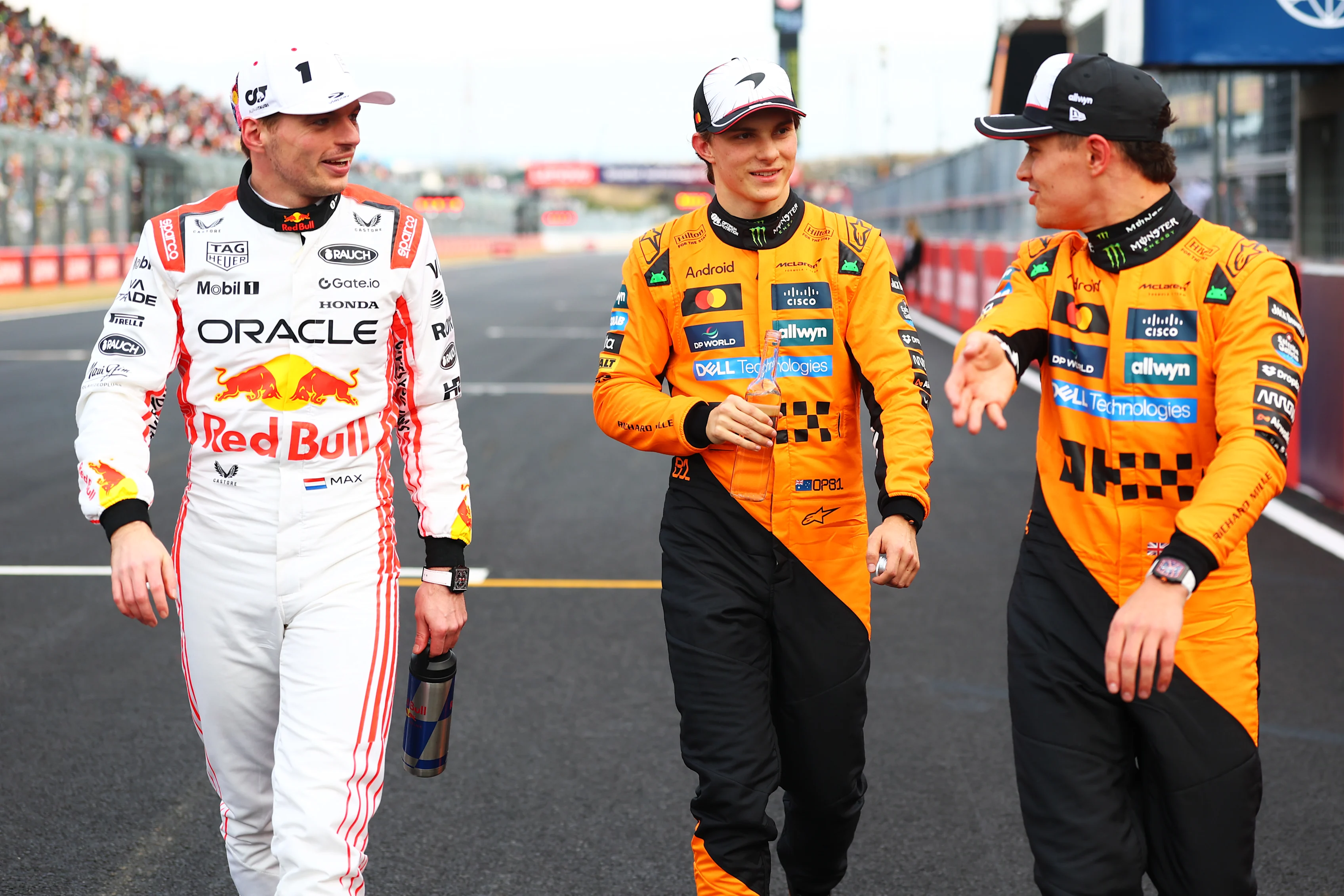SUZUKA, JAPAN - APRIL 05: Pole position qualifier Max Verstappen of the Netherlands and Oracle Red Bull Racing Third placed qualifier Oscar Piastri of Australia and McLaren and Second placed qualifier Lando Norris of Great Britain and McLaren talk in parc ferme during qualifying ahead of the F1 Grand Prix of Japan at Suzuka Circuit on April 05, 2025 in Suzuka, Japan. (Photo by Bryn Lennon - Formula 1/Formula 1 via Getty Images)