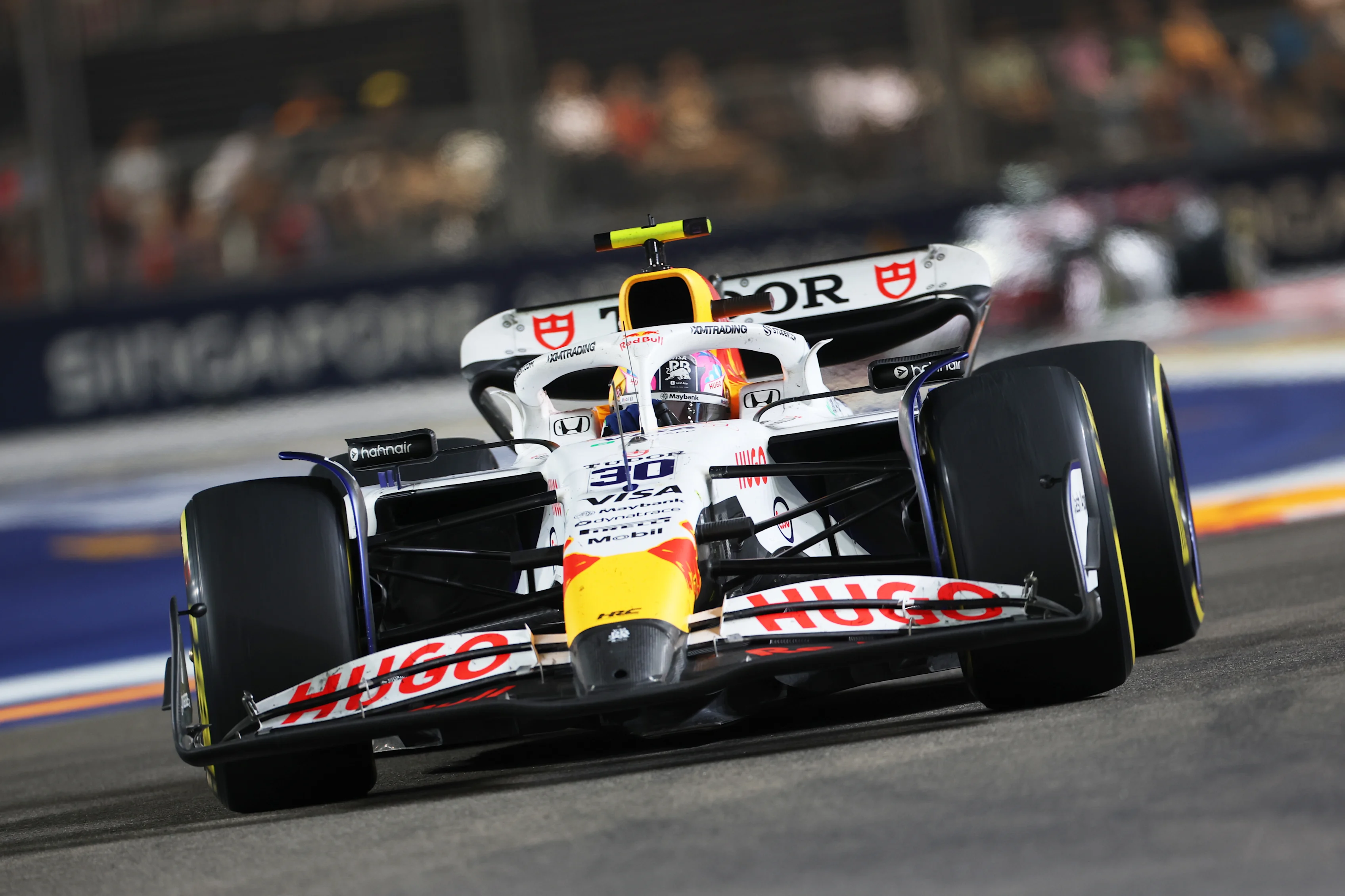 SINGAPORE, SINGAPORE - OCTOBER 05: Liam Lawson of New Zealand driving the (30) Visa Cash App Racing