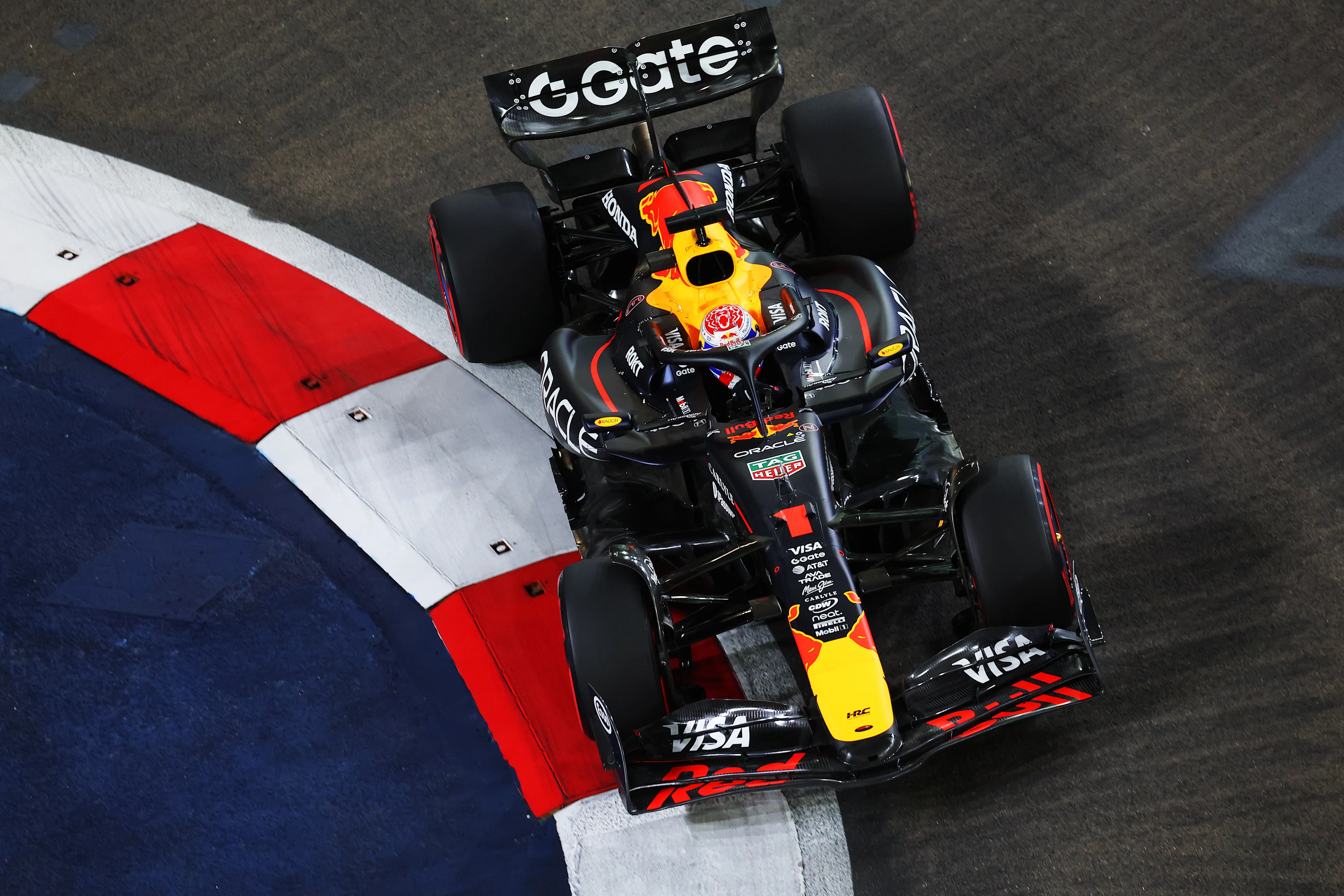 SINGAPORE, SINGAPORE - OCTOBER 03: Max Verstappen of the Netherlands driving the (1) Oracle Red