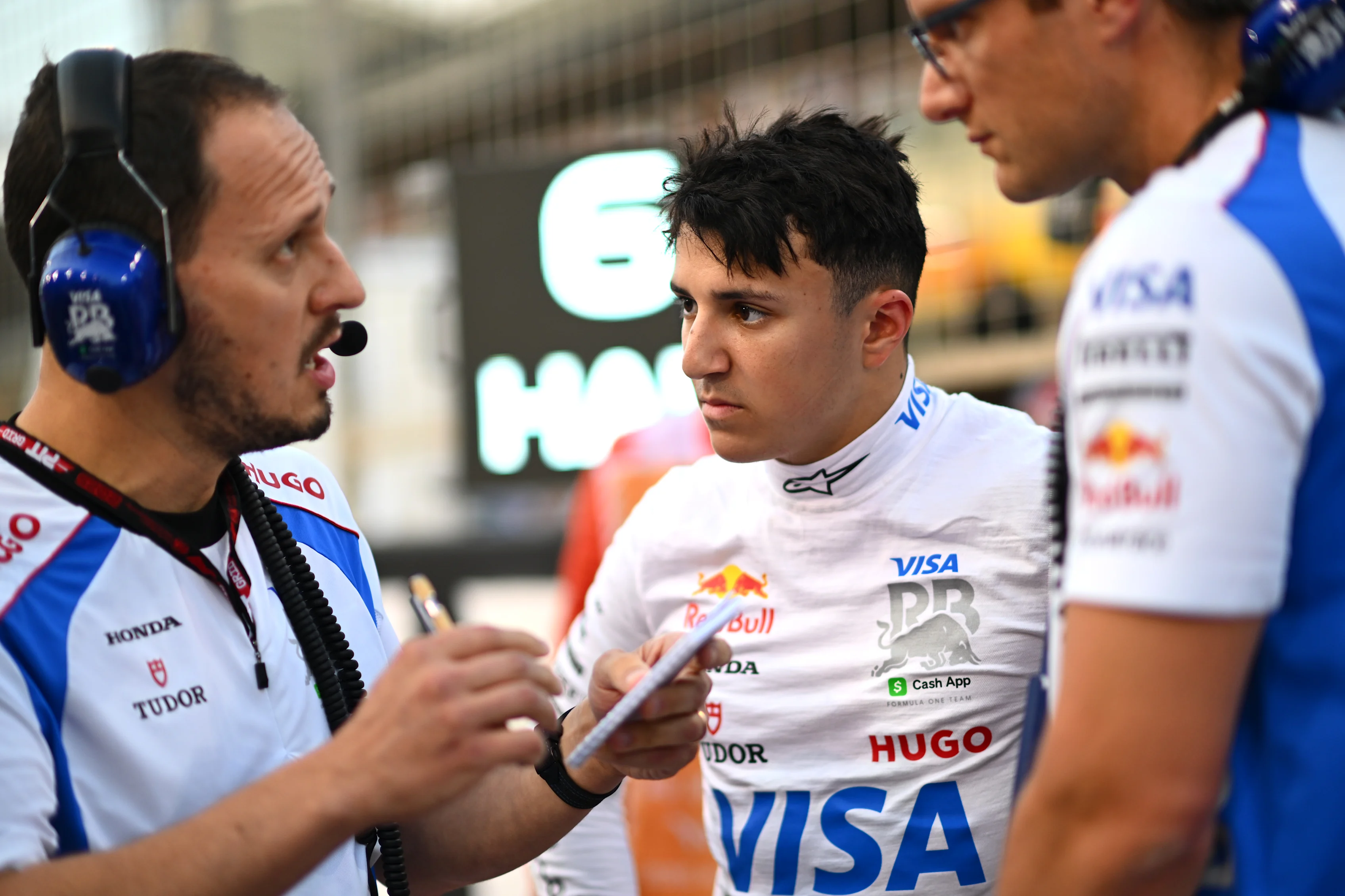 BAHRAIN, BAHRAIN - APRIL 13: Isack Hadjar of France and Visa Cash App Racing Bulls on the grid with engineers during the F1 Grand Prix of Bahrain at Bahrain International Circuit on April 13, 2025 in Bahrain, Bahrain. (Photo by Rudy Carezzevoli/Getty Images)