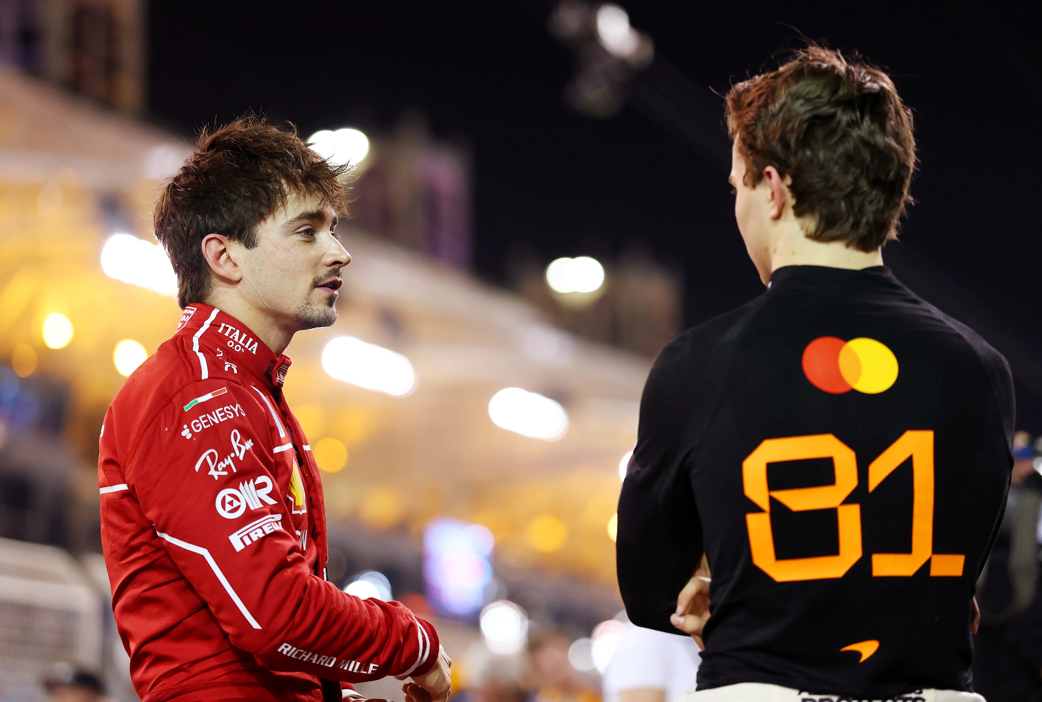 BAHRAIN, BAHRAIN - APRIL 12: Pole position qualifier Oscar Piastri of Australia and McLaren talks with Third placed qualifier Charles Leclerc of Monaco and Scuderia Ferrari in parc ferme during qualifying ahead of the F1 Grand Prix of Bahrain at Bahrain International Circuit on April 12, 2025 in Bahrain, Bahrain. (Photo by Bryn Lennon - Formula 1/Formula 1 via Getty Images)