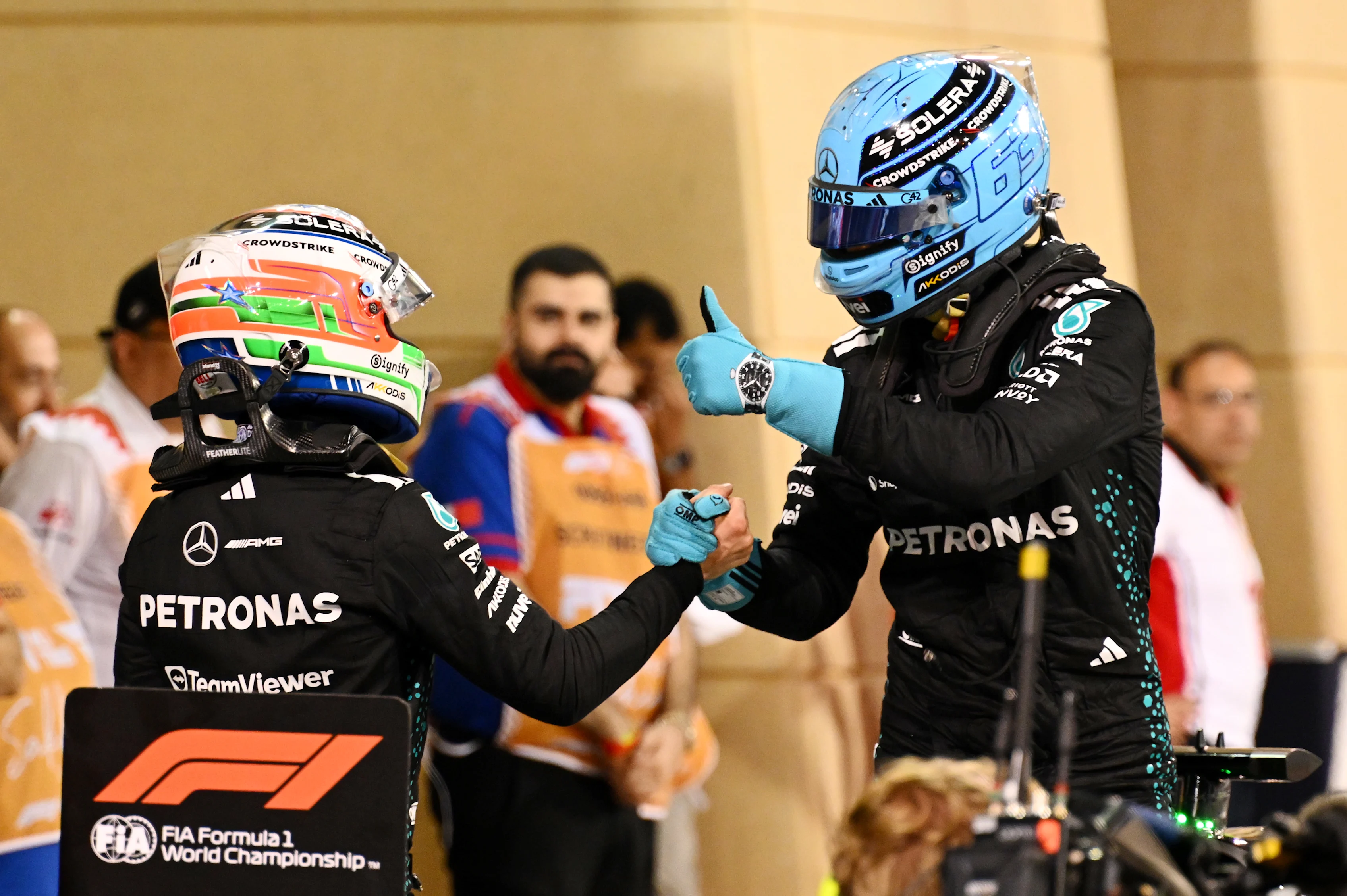BAHRAIN, BAHRAIN - APRIL 12: Second placed qualifier George Russell of Great Britain and Mercedes AMG Petronas F1 Team is congratulated by Fourth placed qualifier Andrea Kimi Antonelli of Italy and Mercedes AMG Petronas F1 Team in parc ferme during qualifying ahead of the F1 Grand Prix of Bahrain at Bahrain International Circuit on April 12, 2025 in Bahrain, Bahrain. (Photo by Mark Sutton - Formula 1/Formula 1 via Getty Images)