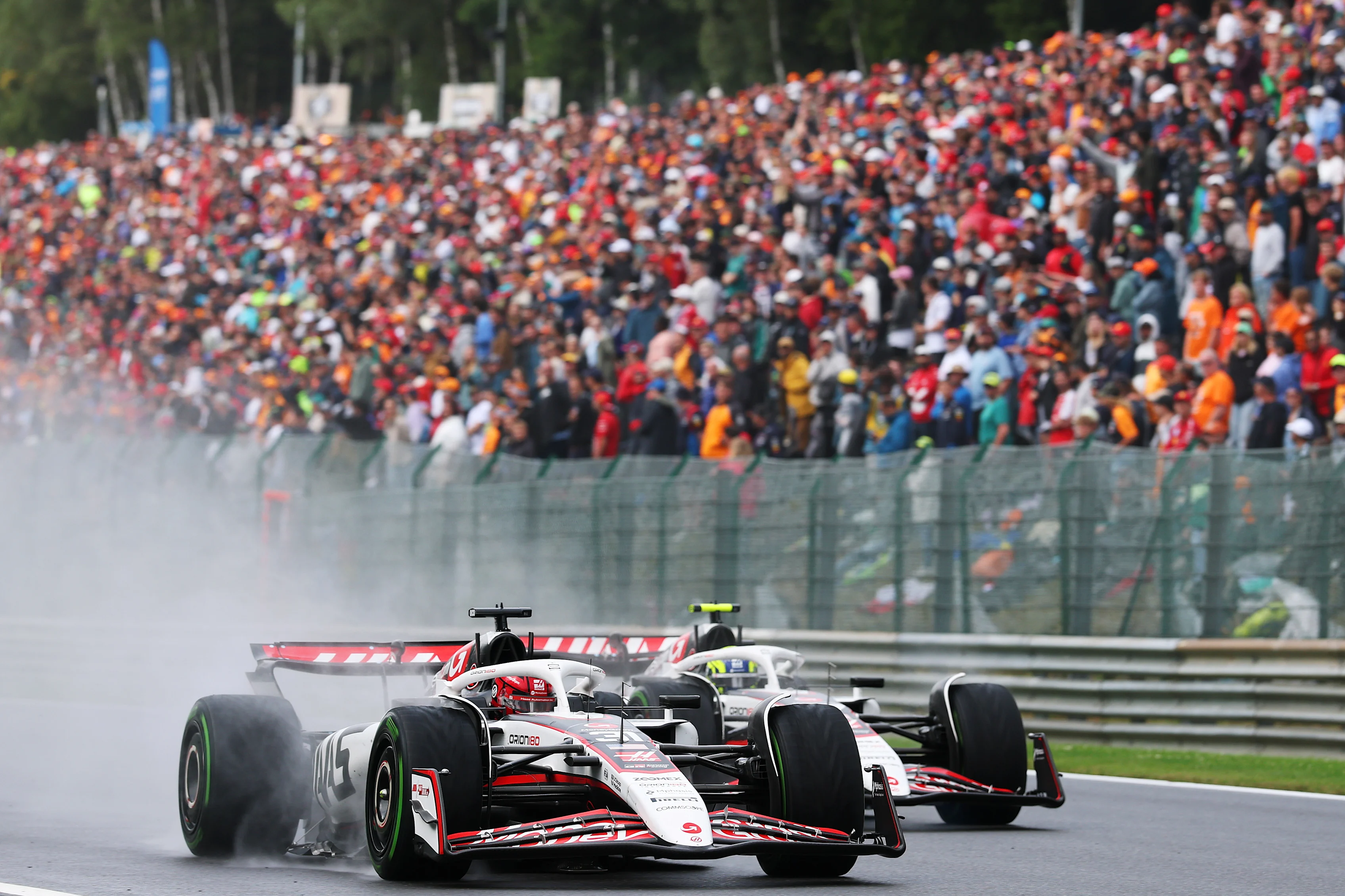SPA, BELGIUM - JULY 27: Esteban Ocon of France driving the (31) Haas F1 VF-25 Ferrari leads Oliver