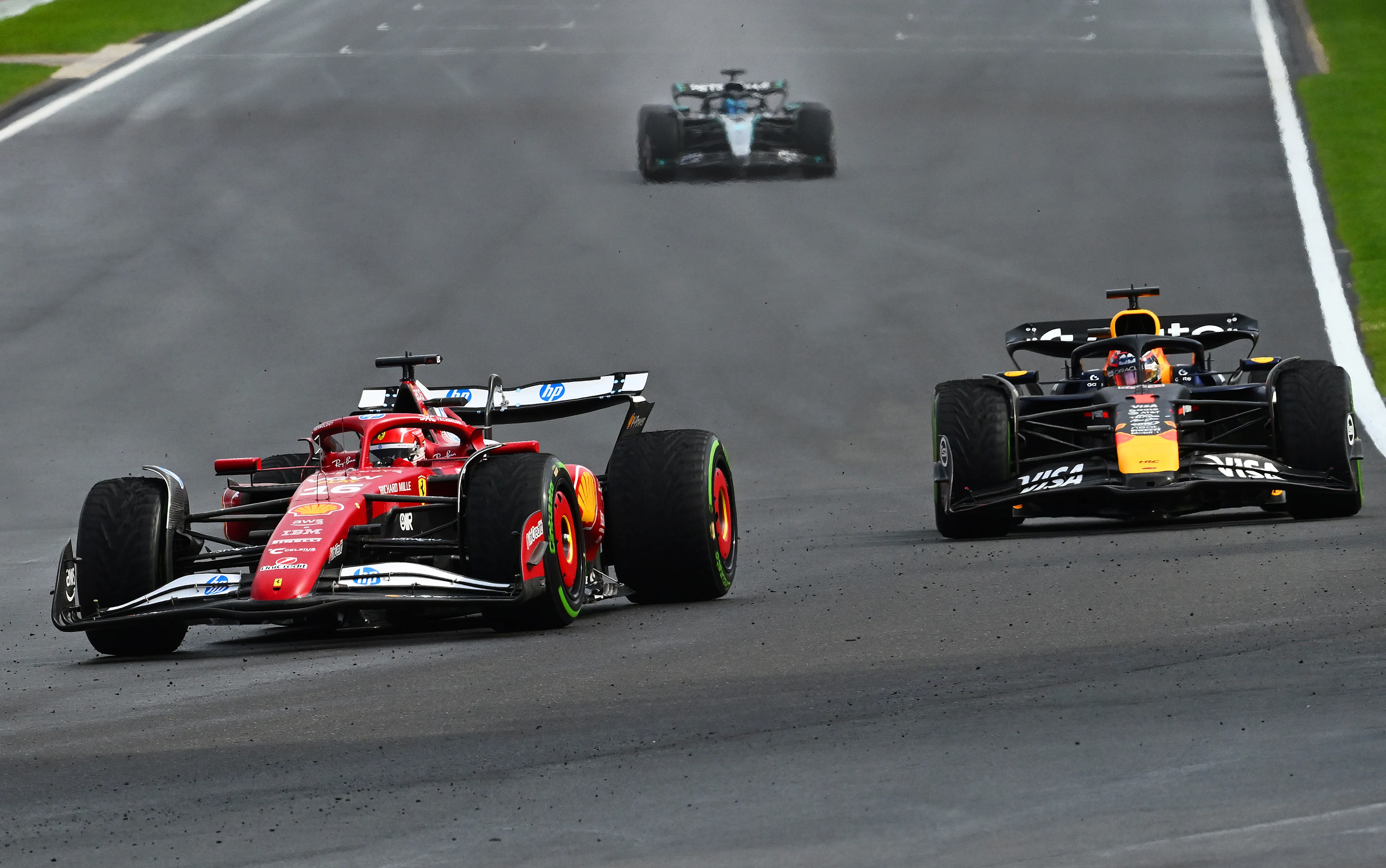SPA, BELGIUM - JULY 27: Charles Leclerc of Monaco driving the (16) Scuderia Ferrari SF-25 leads Max