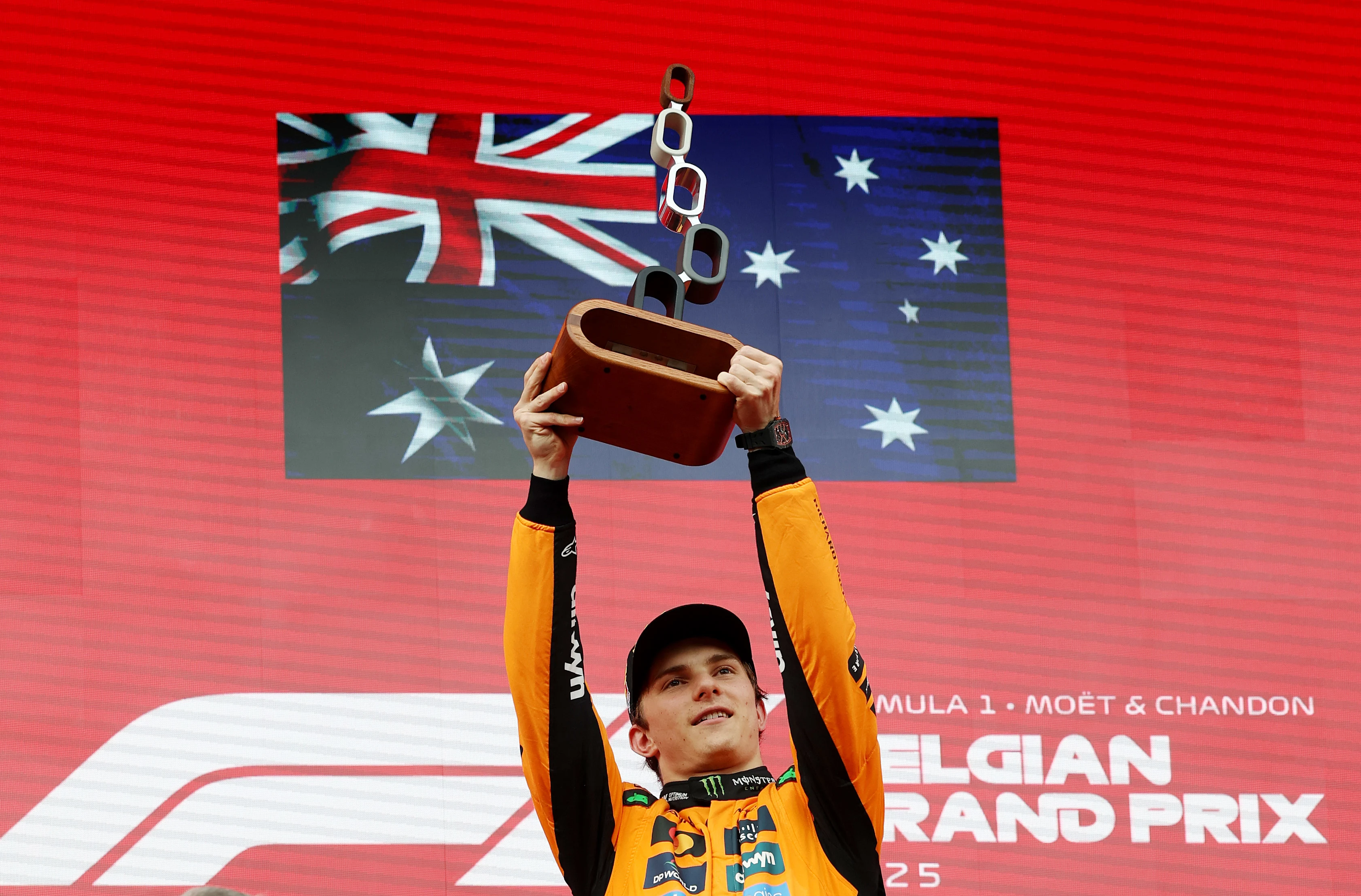 SPA, BELGIUM - JULY 27: Race winner Oscar Piastri of Australia and McLaren lifts his trophy on the