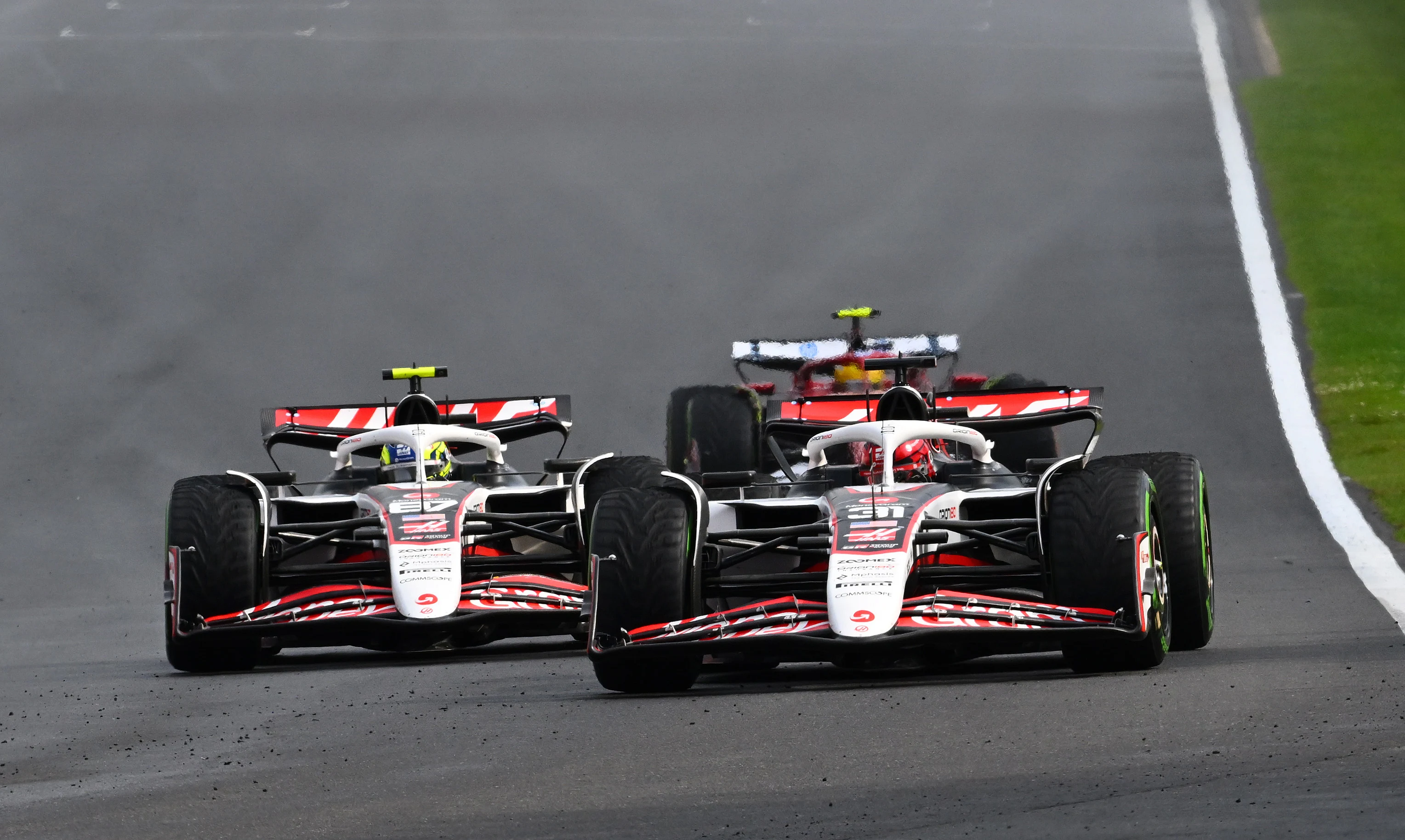 SPA, BELGIUM - JULY 27: Esteban Ocon of France driving the (31) Haas F1 VF-25 Ferrari leads Oliver
