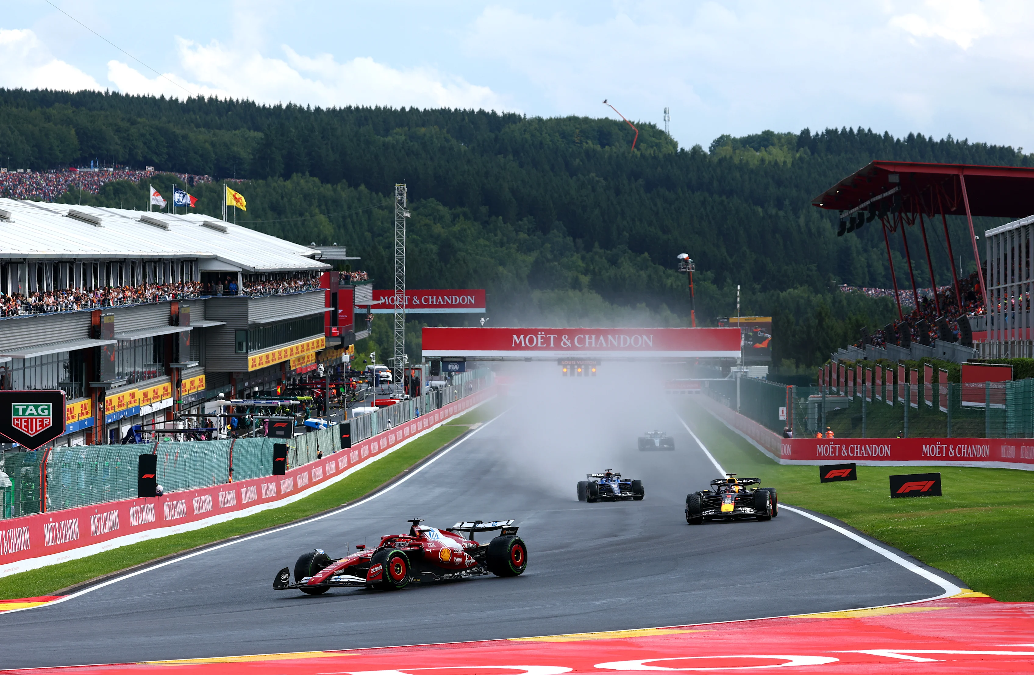 SPA, BELGIUM - JULY 27: Charles Leclerc of Monaco driving the (16) Scuderia Ferrari SF-25 leads Max