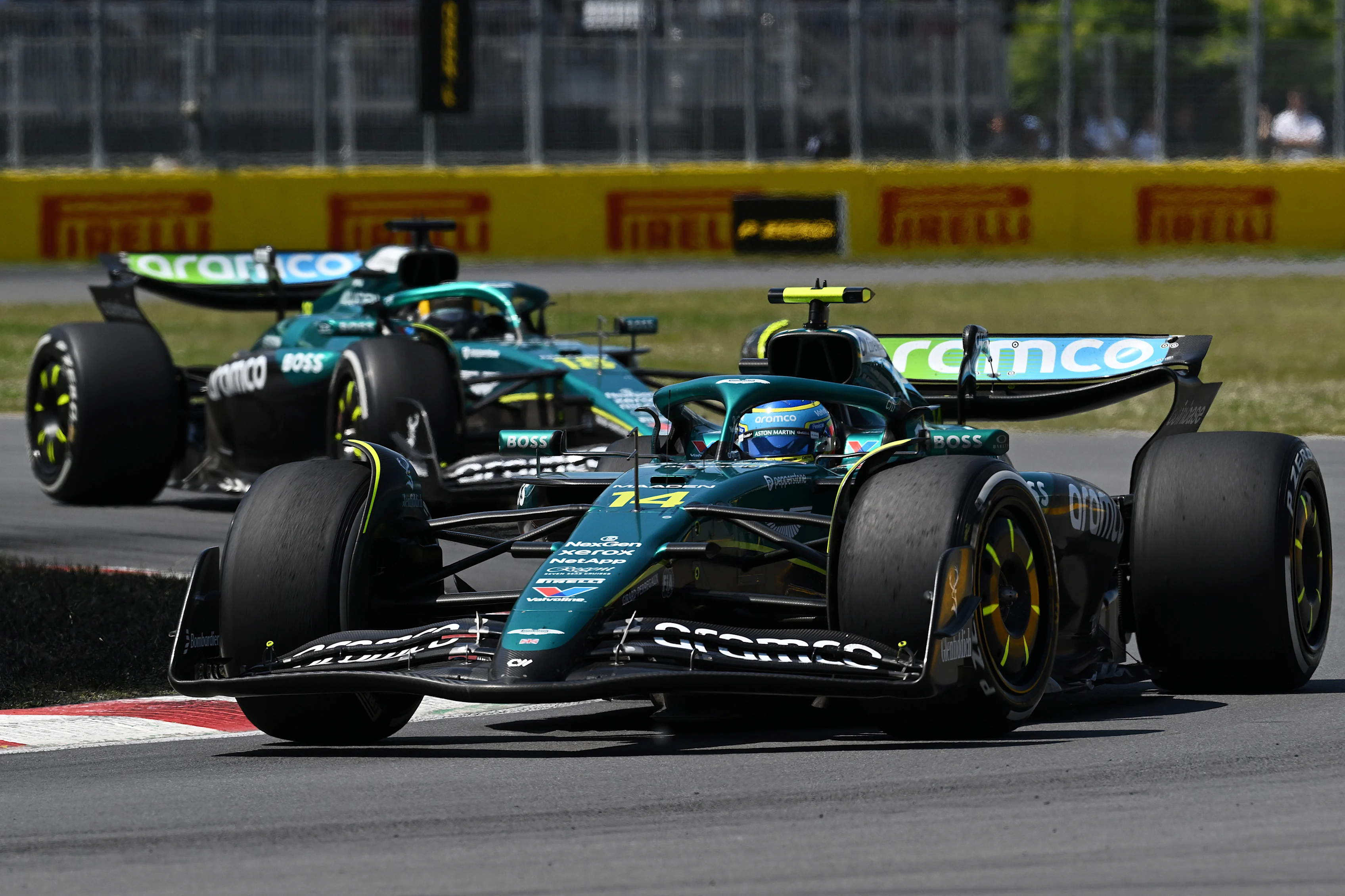 MONTREAL, QUEBEC - JUNE 15: Fernando Alonso of Spain driving the (14) Aston Martin F1 Team AMR25 Mercedes leads Lance Stroll of Canada driving the (18) Aston Martin F1 Team AMR25 Mercedes on track during the F1 Grand Prix of Canada at Circuit Gilles-Villeneuve on June 15, 2025 in Montreal, Quebec. (Photo by Mark Sutton - Formula 1/Formula 1 via Getty Images)