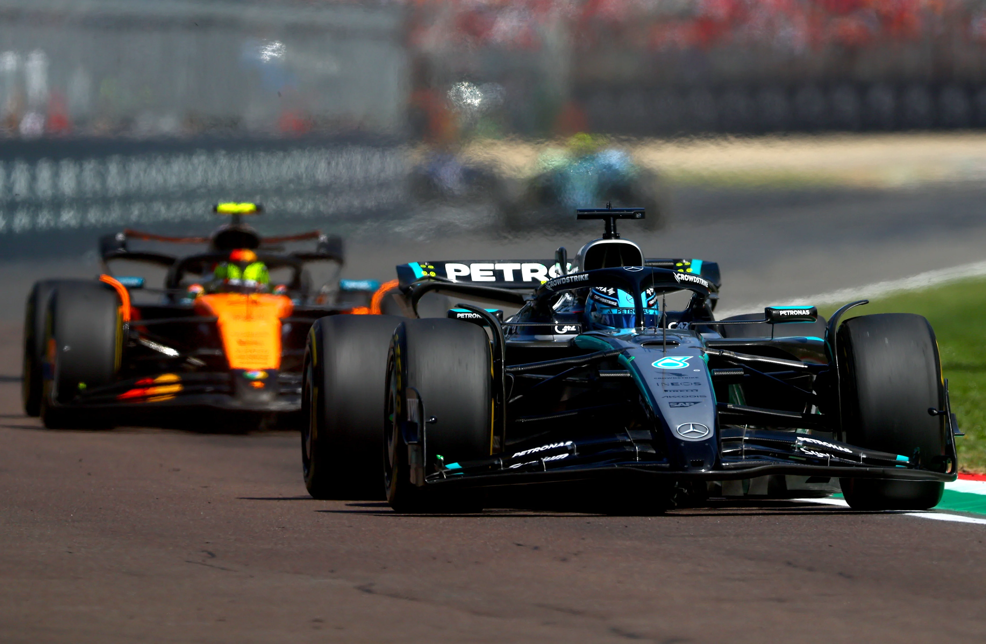 IMOLA, ITALY - MAY 18: George Russell of Great Britain driving the (63) Mercedes AMG Petronas F1 Team W16 leads Lando Norris of Great Britain driving the (4) McLaren MCL39 Mercedes on track during the F1 Grand Prix of Emilia-Romagna at Autodromo Internazionale Enzo e Dino Ferrari on May 18, 2025 in Imola, Italy. (Photo by Bryn Lennon - Formula 1/Formula 1 via Getty Images)