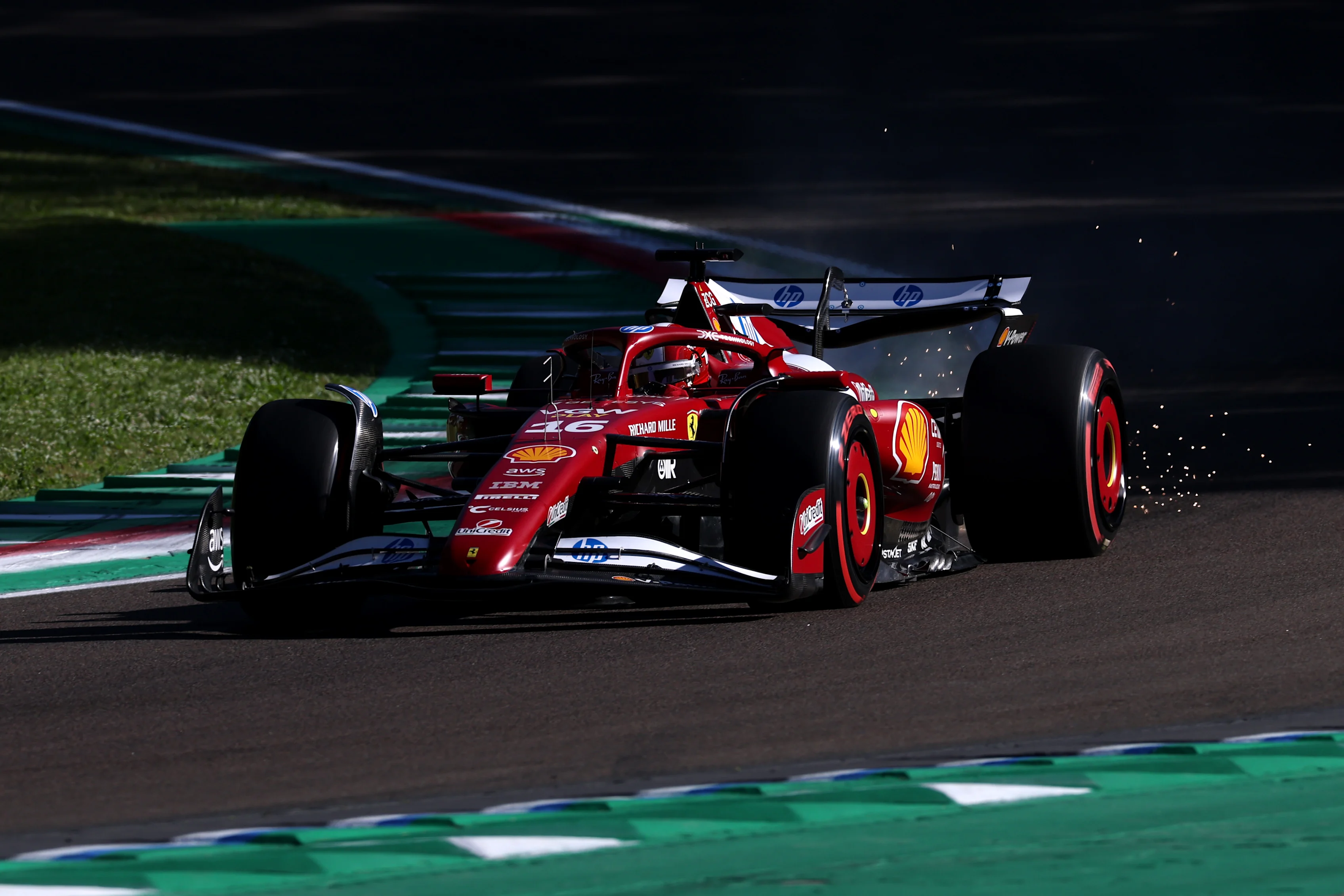 IMOLA, ITALY - MAY 16: Sparks fly behind Charles Leclerc of Monaco driving the (16) Scuderia Ferrari SF-25 on track during practice ahead of the F1 Grand Prix of Emilia-Romagna at Autodromo Internazionale Enzo e Dino Ferrari on May 16, 2025 in Imola, Italy. (Photo by Ryan Pierse/Getty Images)
