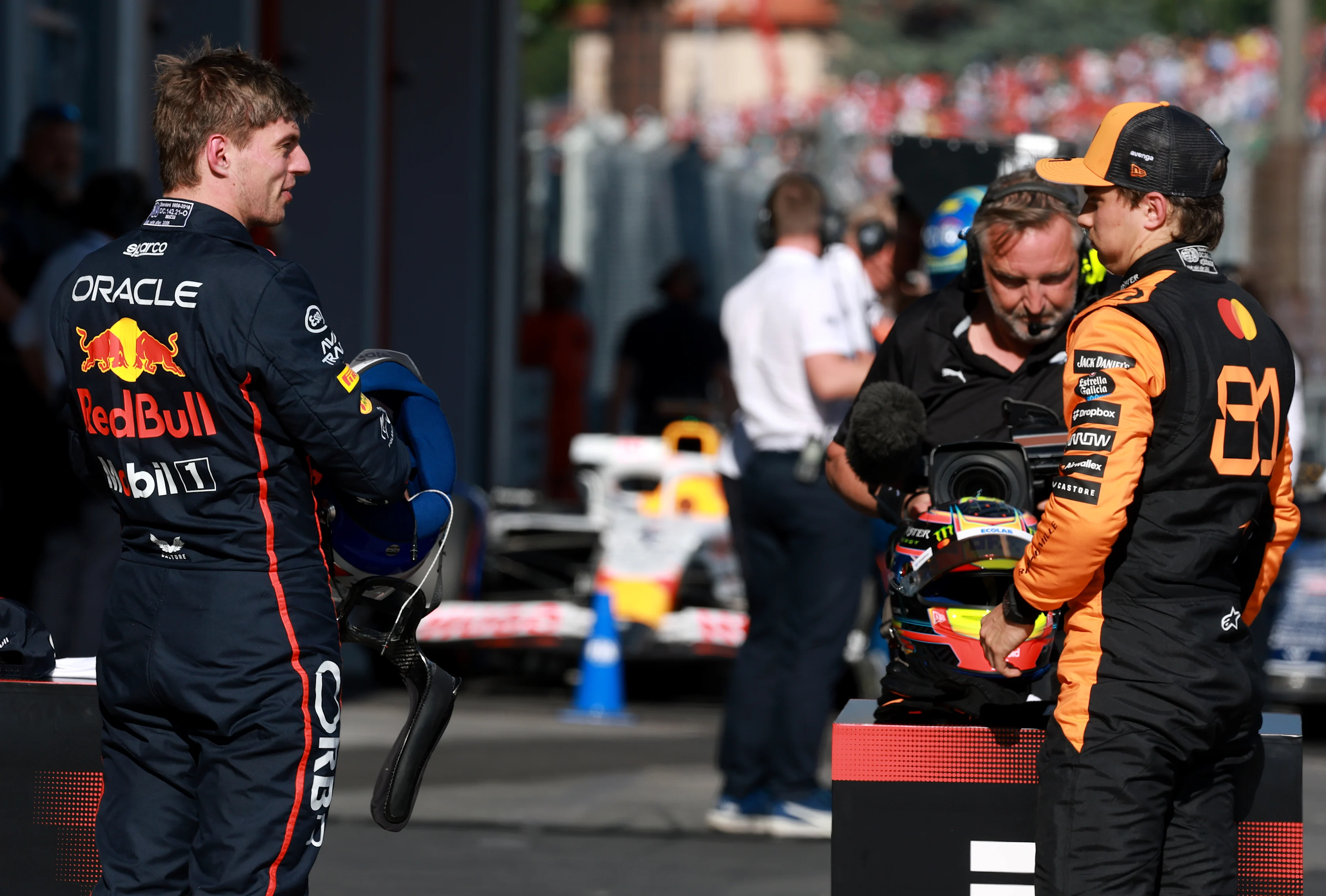 IMOLA, ITALY - MAY 17: Second placed qualifier Max Verstappen of the Netherlands and Oracle Red Bull Racing and Pole position qualifier Oscar Piastri of Australia and McLaren talk in parc ferme during qualifying ahead of the F1 Grand Prix of Emilia-Romagna at Autodromo Internazionale Enzo e Dino Ferrari on May 17, 2025 in Imola, Italy. (Photo by Mark Thompson/Getty Images)