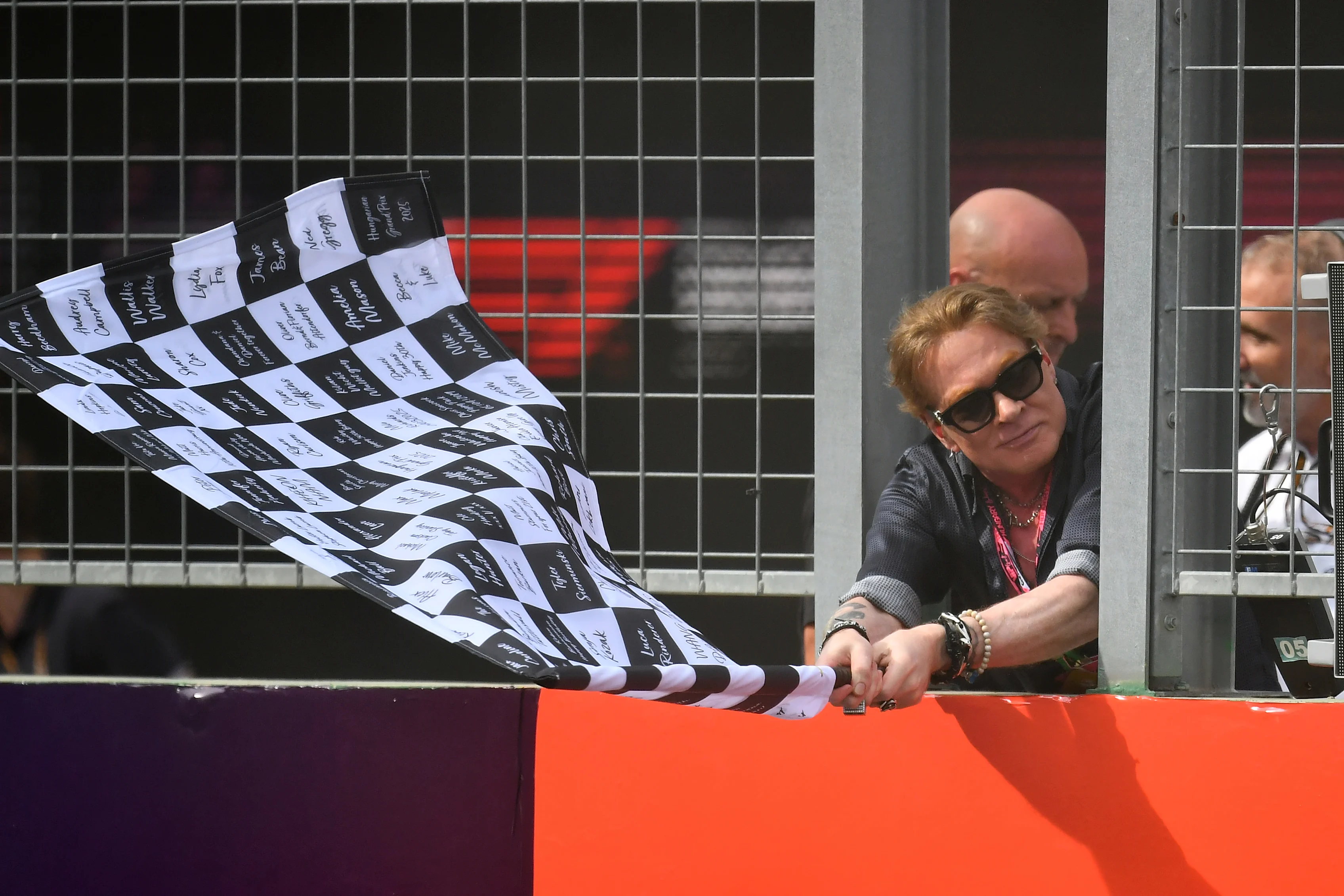 BUDAPEST, HUNGARY - AUGUST 03: Axl Rose waves the chequered flag during the F1 Grand Prix of