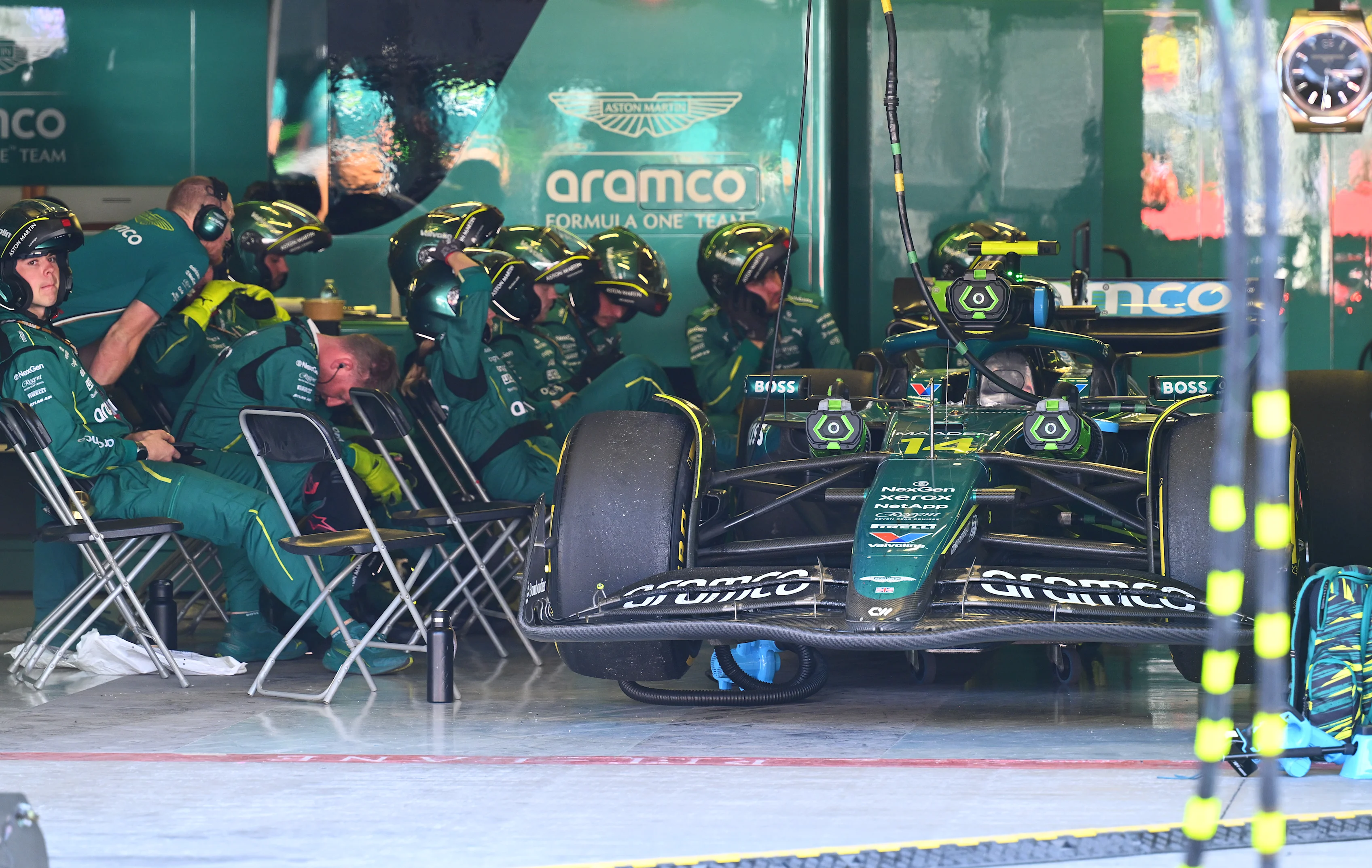 MEXICO CITY, MEXICO - OCTOBER 26: Aston Martin F1 Team pit crew in the garage with the retired car