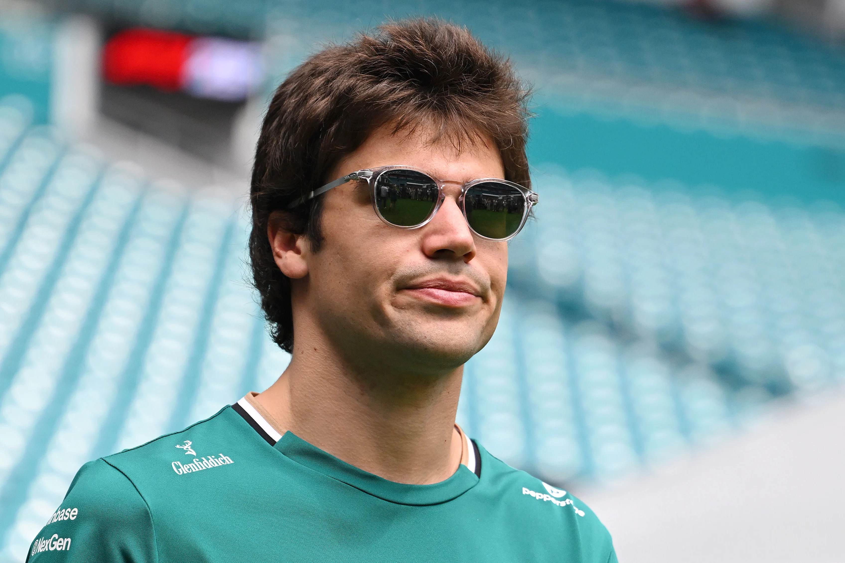 MIAMI, FLORIDA - MAY 04: Lance Stroll of Canada and Aston Martin F1 Team looks on in the Paddock