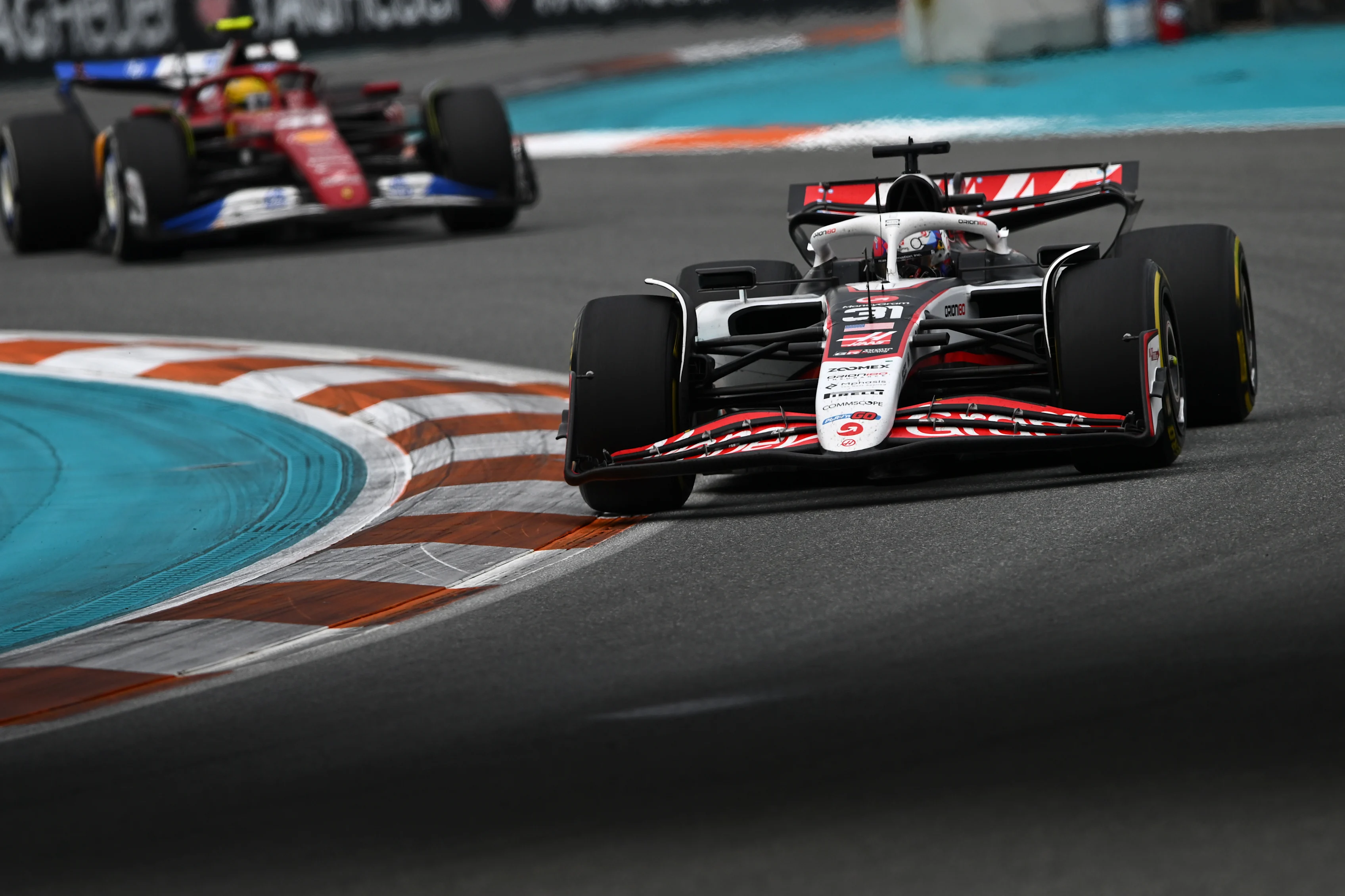 MIAMI, FLORIDA - MAY 04: Esteban Ocon of France driving the (31) Haas F1 VF-25 Ferrari leads Lewis