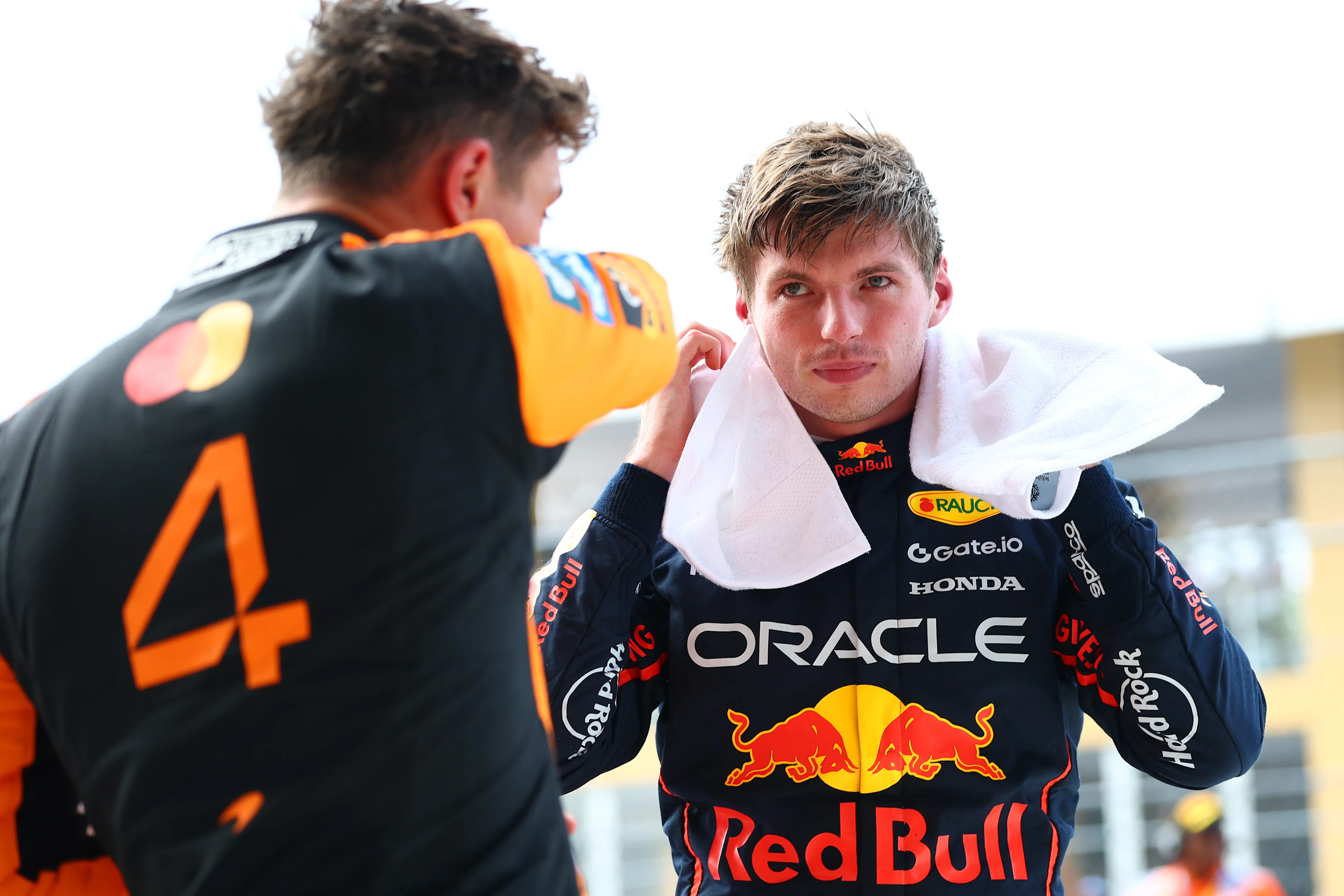 MIAMI, FLORIDA - MAY 03: Pole position qualifier Max Verstappen of the Netherlands and Oracle Red Bull Racing and Second placed qualifier Lando Norris of Great Britain and McLaren talk in parc ferme during qualifying ahead of the F1 Grand Prix of Miami at Miami International Autodrome on May 03, 2025 in Miami, Florida. (Photo by Bryn Lennon - Formula 1/Formula 1 via Getty Images)