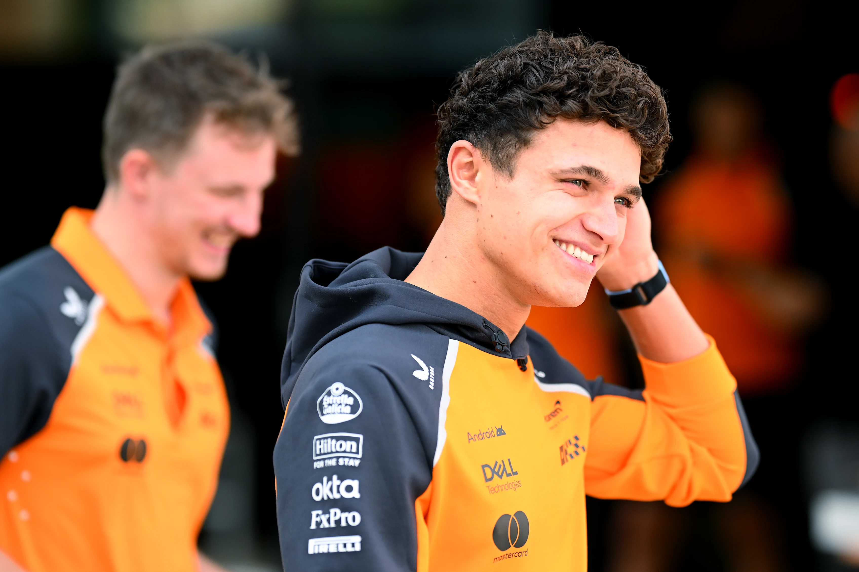LUSAIL CITY, QATAR - NOVEMBER 27: Lando Norris of Great Britain and McLaren looks on in the Paddock