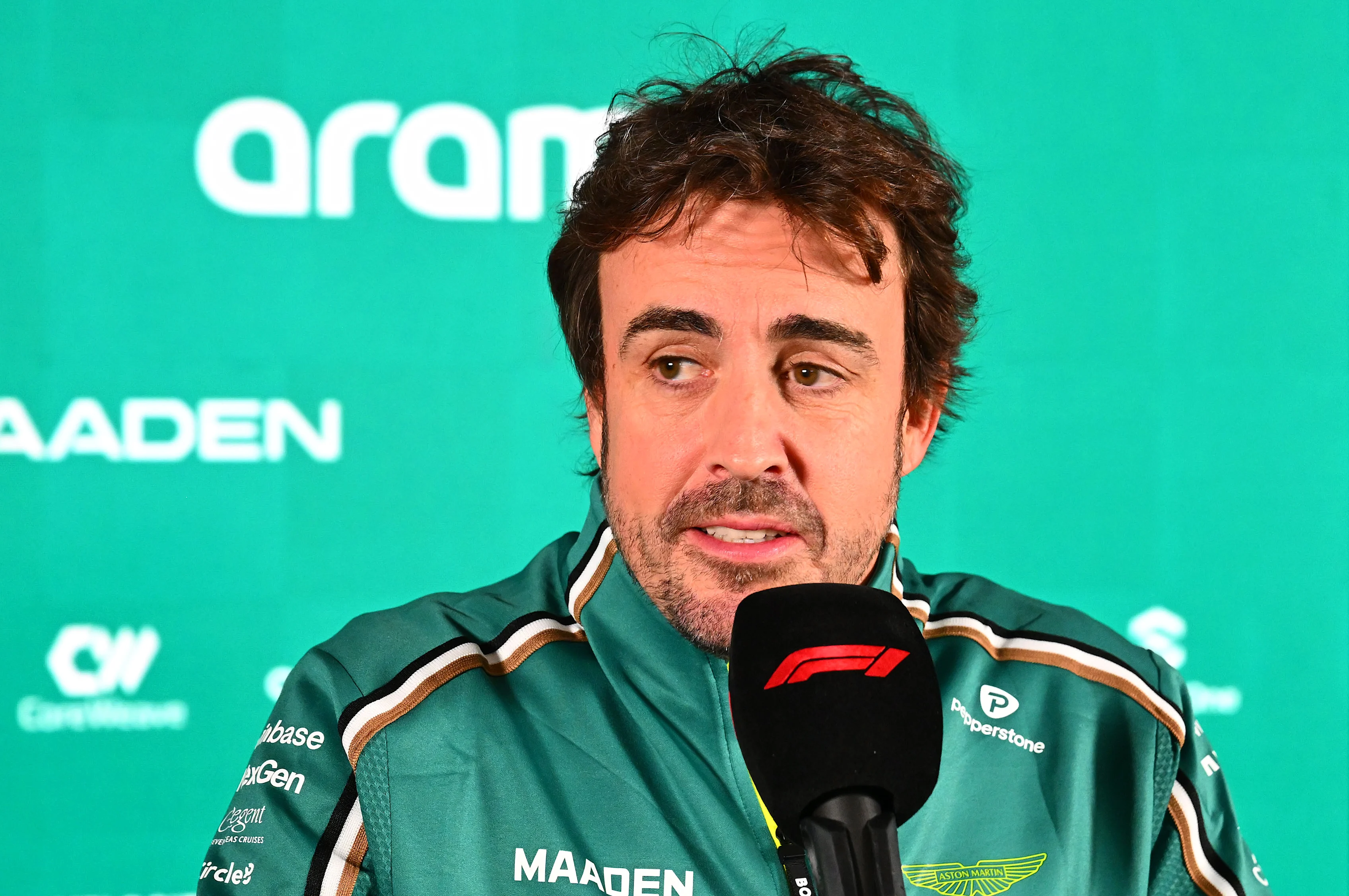 LUSAIL CITY, QATAR - NOVEMBER 27: Fernando Alonso of Spain and Aston Martin F1 Team talks to the