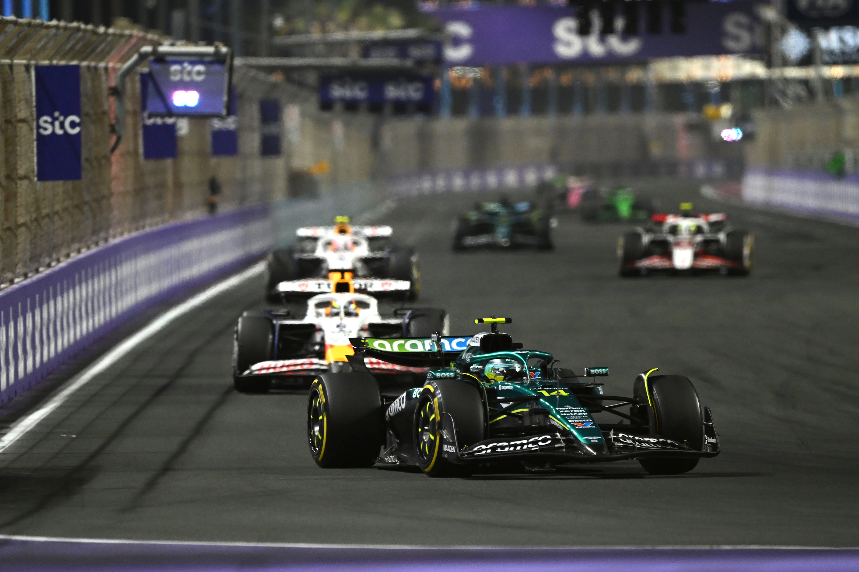 JEDDAH, SAUDI ARABIA - APRIL 20: Fernando Alonso of Spain driving the (14) Aston Martin F1 Team AMR25 Mercedes leads Isack Hadjar of France driving the (6) Visa Cash App Racing Bulls VCARB 02 and Liam Lawson of New Zealand driving the (30) Visa Cash App Racing Bulls VCARB 02 on track during the F1 Grand Prix of Saudi Arabia at Jeddah Corniche Circuit on April 20, 2025 in Jeddah, Saudi Arabia. (Photo by Mark Sutton - Formula 1/Formula 1 via Getty Images)