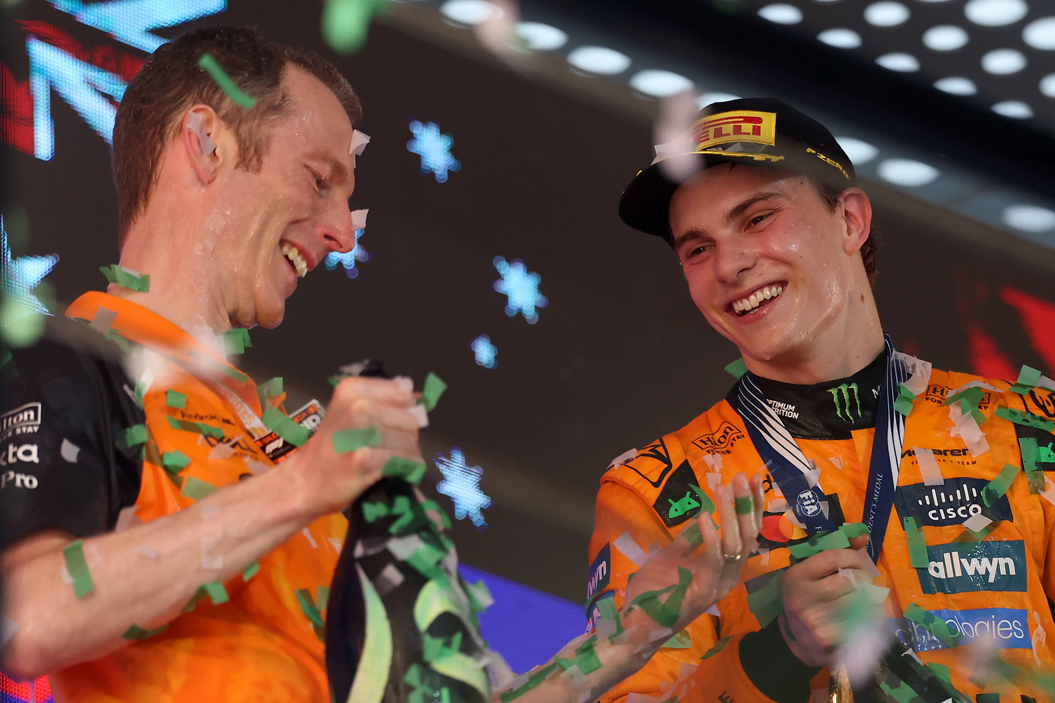 JEDDAH, SAUDI ARABIA - APRIL 20: Race winner Oscar Piastri of Australia and McLaren celebrates with his teammate on the podium during the F1 Grand Prix of Saudi Arabia at Jeddah Corniche Circuit on April 20, 2025 in Jeddah, Saudi Arabia. (Photo by Alex Pantling/Getty Images)