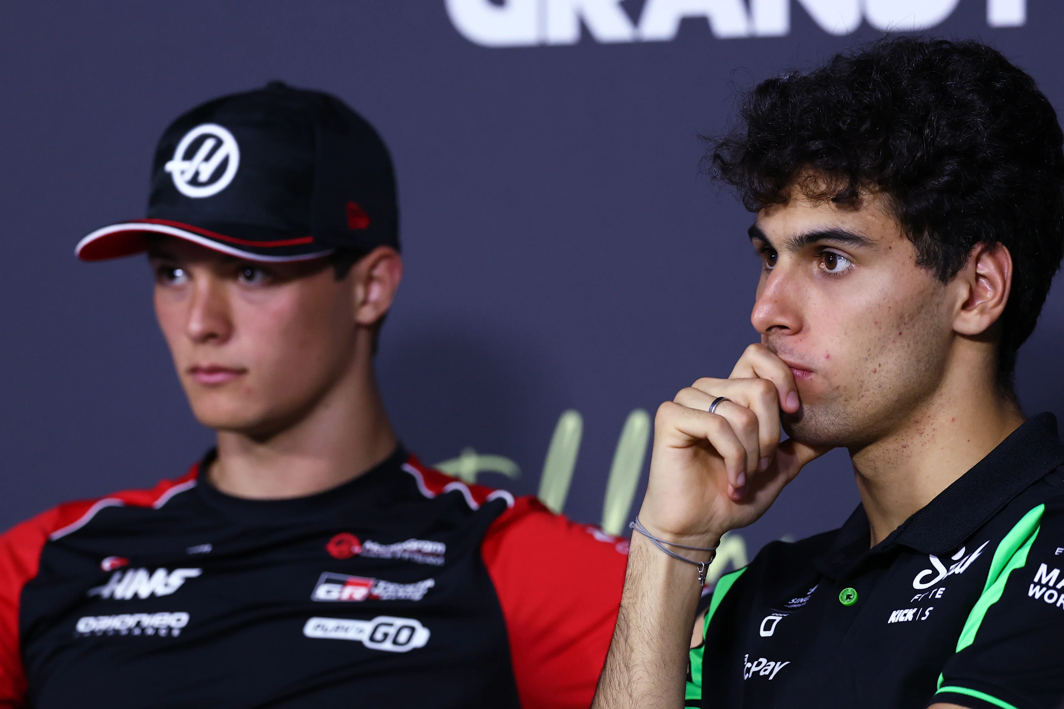 JEDDAH, SAUDI ARABIA - APRIL 17: Oliver Bearman of Great Britain and Haas F1 and Gabriel Bortoleto of Brazil and Stake F1 Team Kick Sauber look on during the Drivers Press Conference during previews ahead of the F1 Grand Prix of Saudi Arabia at Jeddah Corniche Circuit on April 17, 2025 in Jeddah, Saudi Arabia. (Photo by Clive Rose/Getty Images)