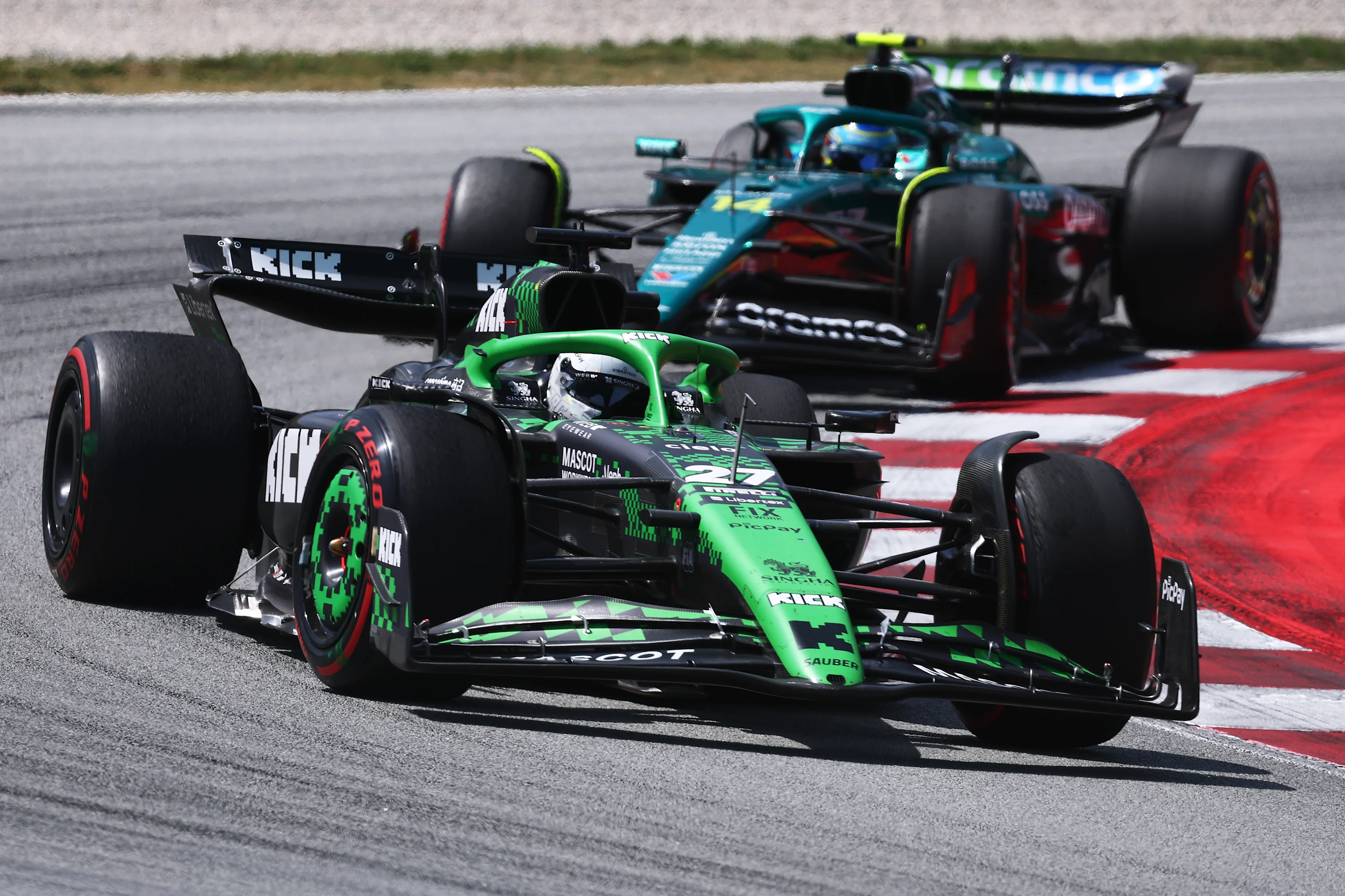BARCELONA, SPAIN - JUNE 01: Nico Hulkenberg of Germany driving the (27) Kick Sauber C45 Ferrari leads Fernando Alonso of Spain driving the (14) Aston Martin F1 Team AMR25 Mercedes on track during the F1 Grand Prix of Spain at Circuit de Barcelona-Catalunya on June 01, 2025 in Barcelona, Spain. (Photo by Clive Rose - Formula 1/Formula 1 via Getty Images)