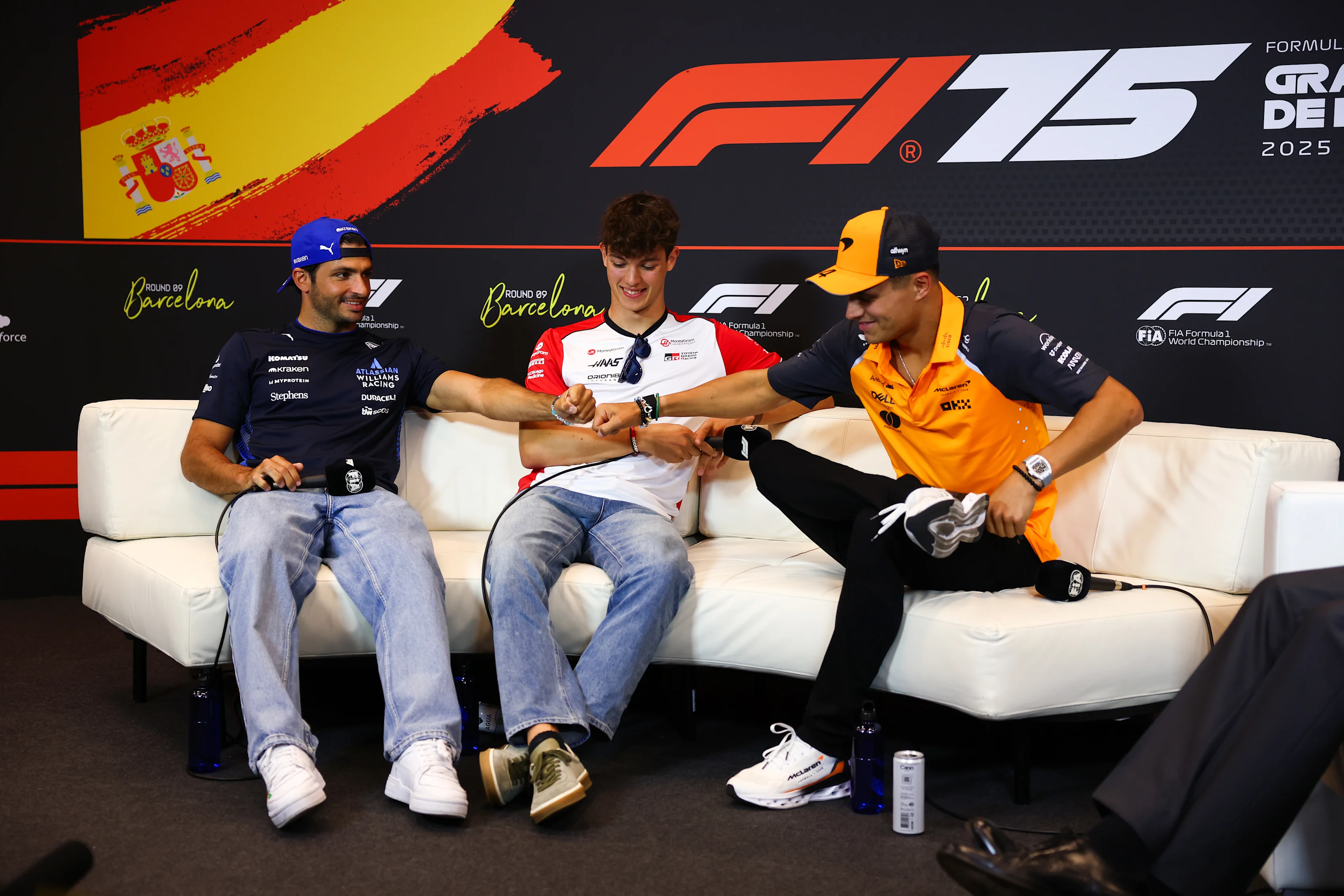 BARCELONA, SPAIN - MAY 29: Carlos Sainz of Spain and Williams, Oliver Bearman of Great Britain and Haas F1 and Lando Norris of Great Britain and McLaren in the Drivers Press Conference during previews ahead of the F1 Grand Prix of Spain at Circuit de Barcelona-Catalunya on May 29, 2025 in Barcelona, Spain. (Photo by Clive Rose/Getty Images)