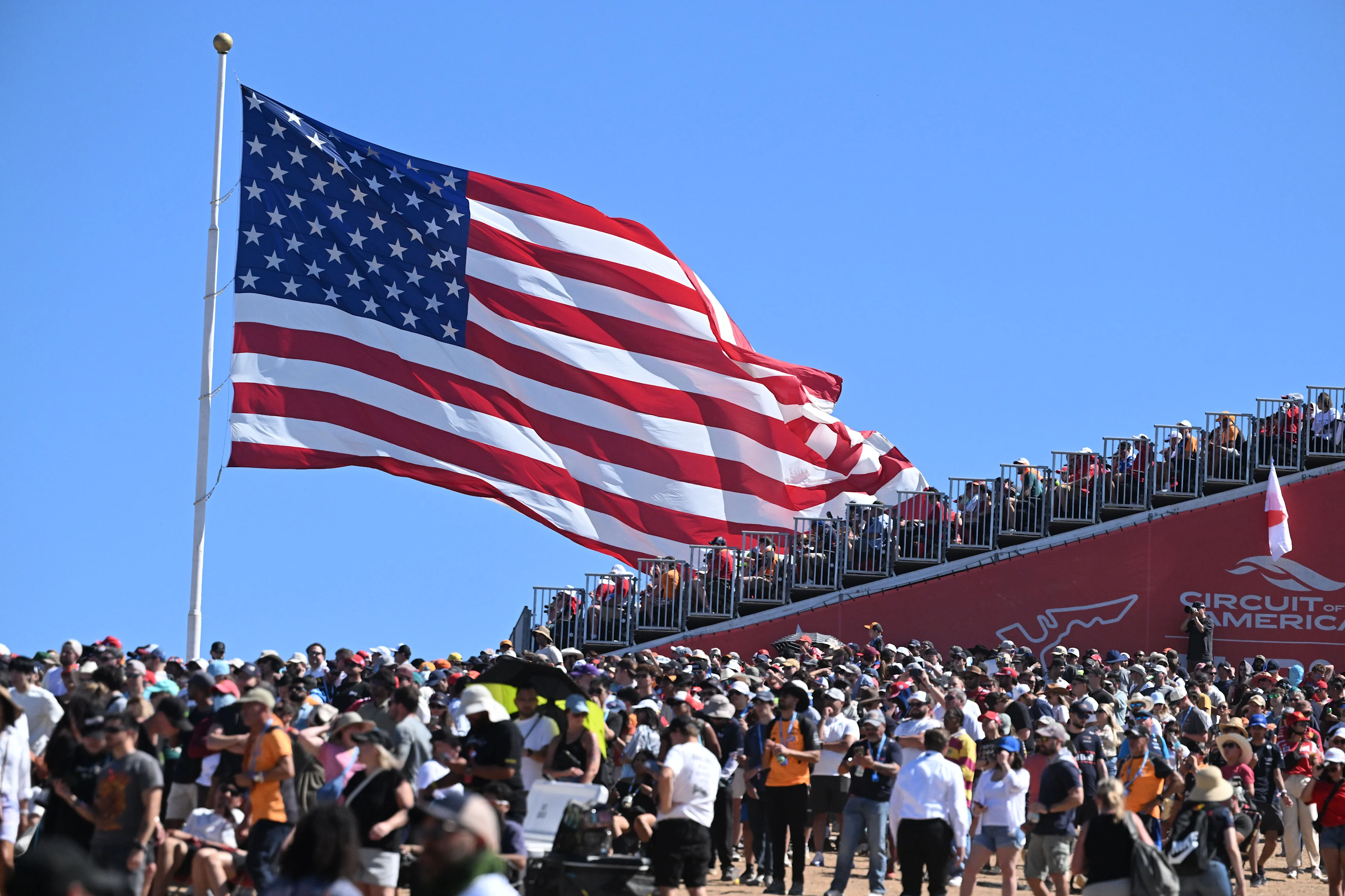 AUSTIN, TEXAS - OCTOBER 19: A huge crowd and huge US flag during the F1 Grand Prix of United States
