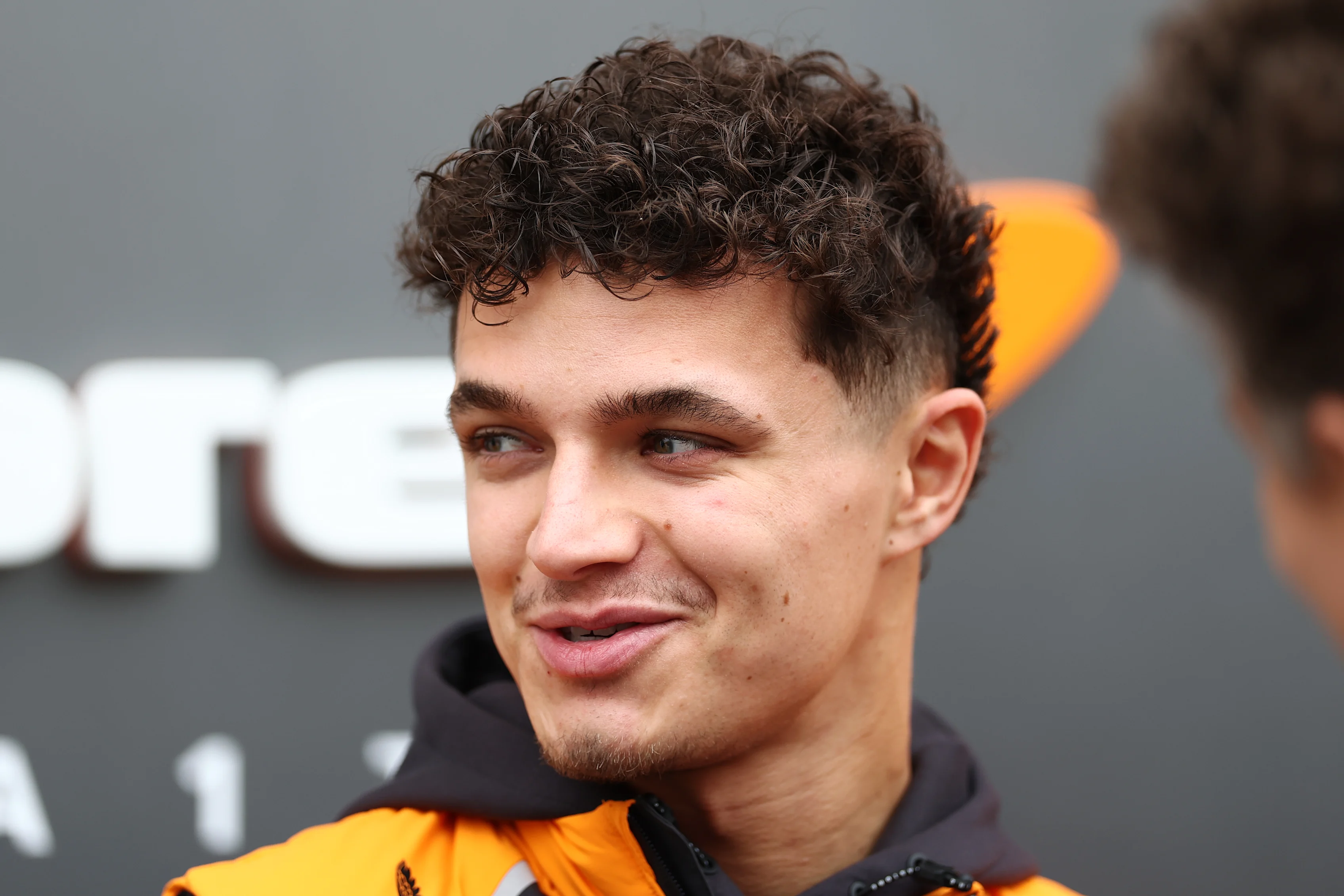BAHRAIN, BAHRAIN - FEBRUARY 27: Lando Norris of Great Britain and McLaren looks on in the Paddock