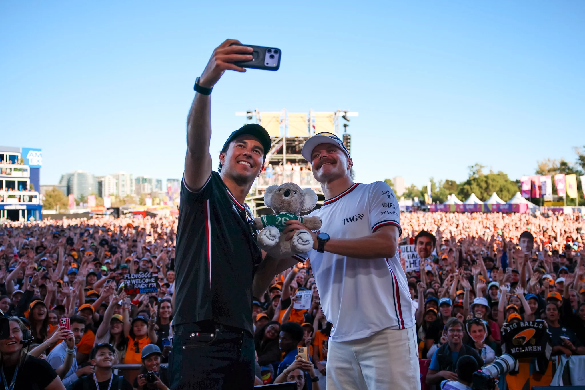MELBOURNE, AUSTRALIA - MARCH 05: Sergio Perez of Mexico and Cadillac F1 Team and Valtteri Bottas of