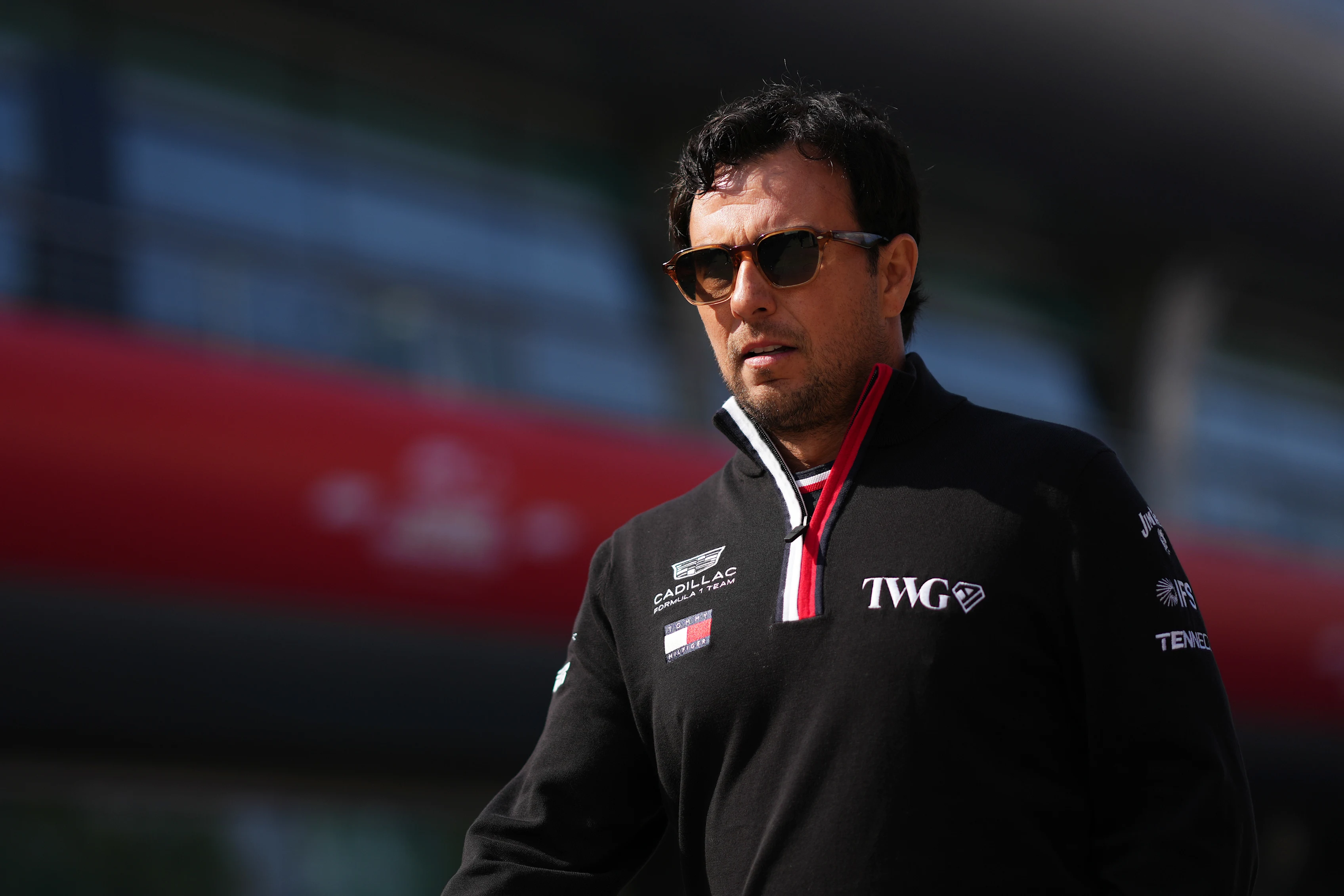 SHANGHAI, CHINA - MARCH 12: Sergio Perez of Mexico and Cadillac F1 Team walks in the Paddock during