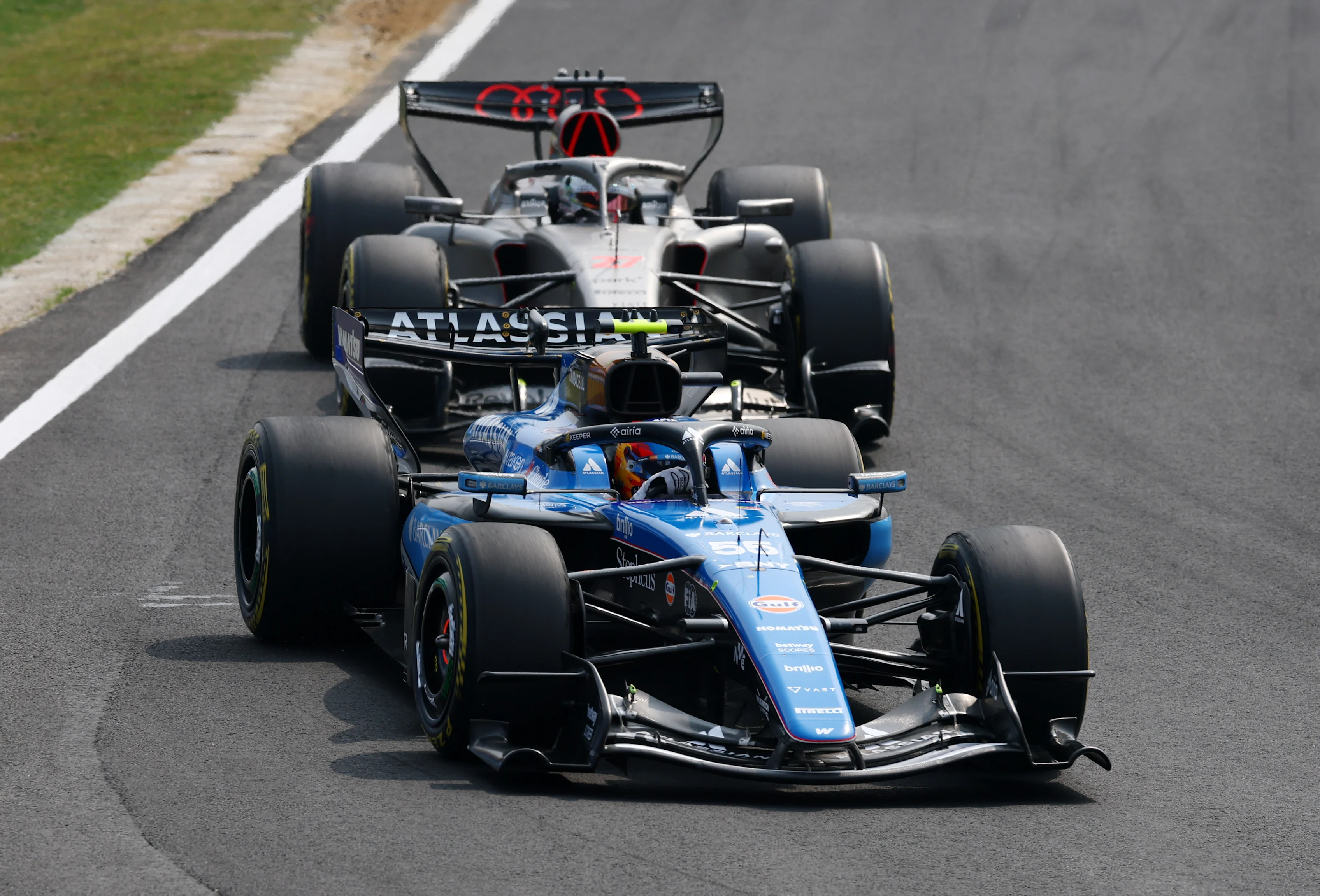 SUZUKA, JAPAN - MARCH 29: Carlos Sainz of Spain driving the (55) Williams FW48 Mercedes leads Nico