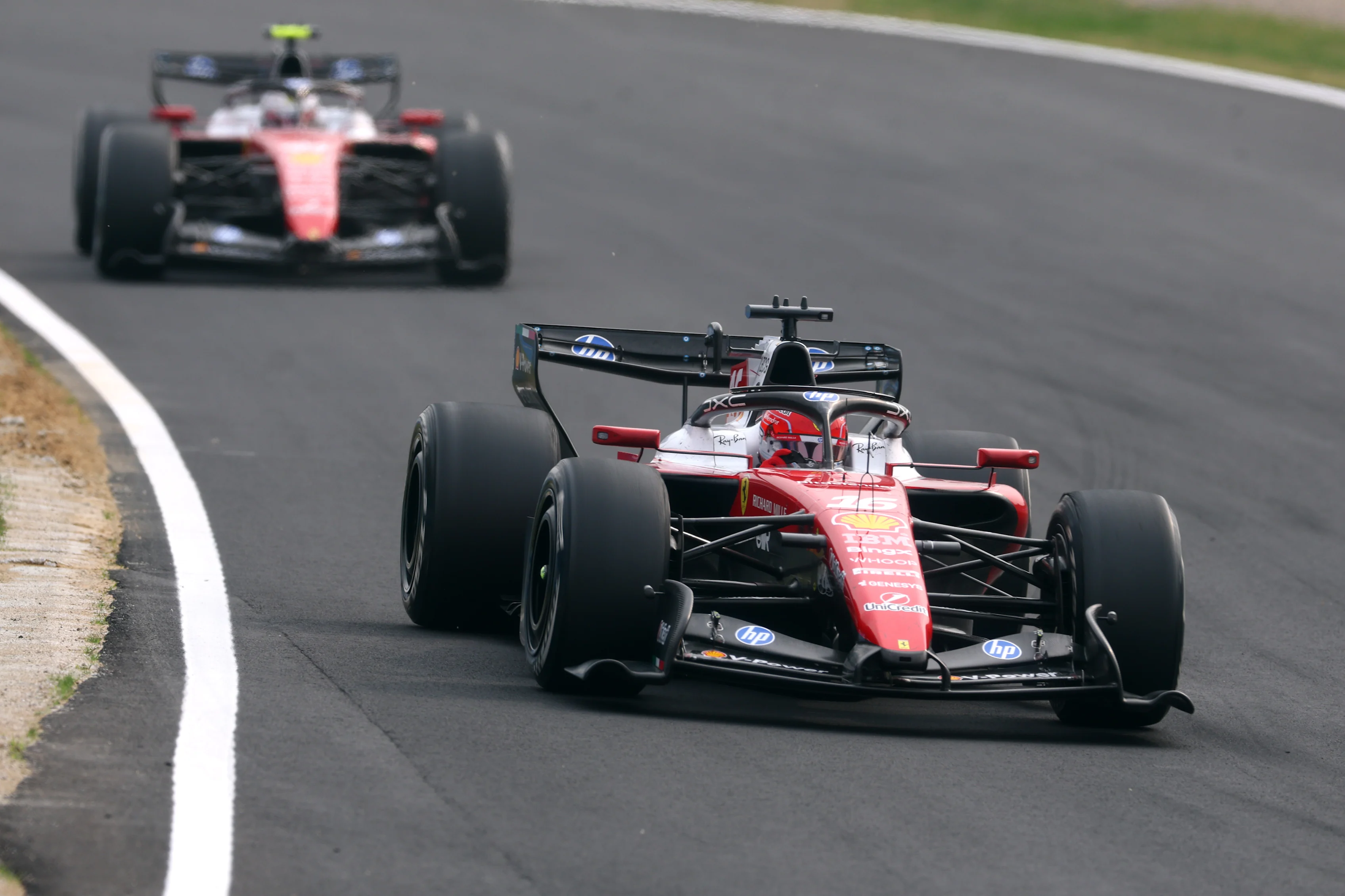 SUZUKA, JAPAN - MARCH 29: Charles Leclerc of Monaco driving the (16) Scuderia Ferrari SF-26 leads