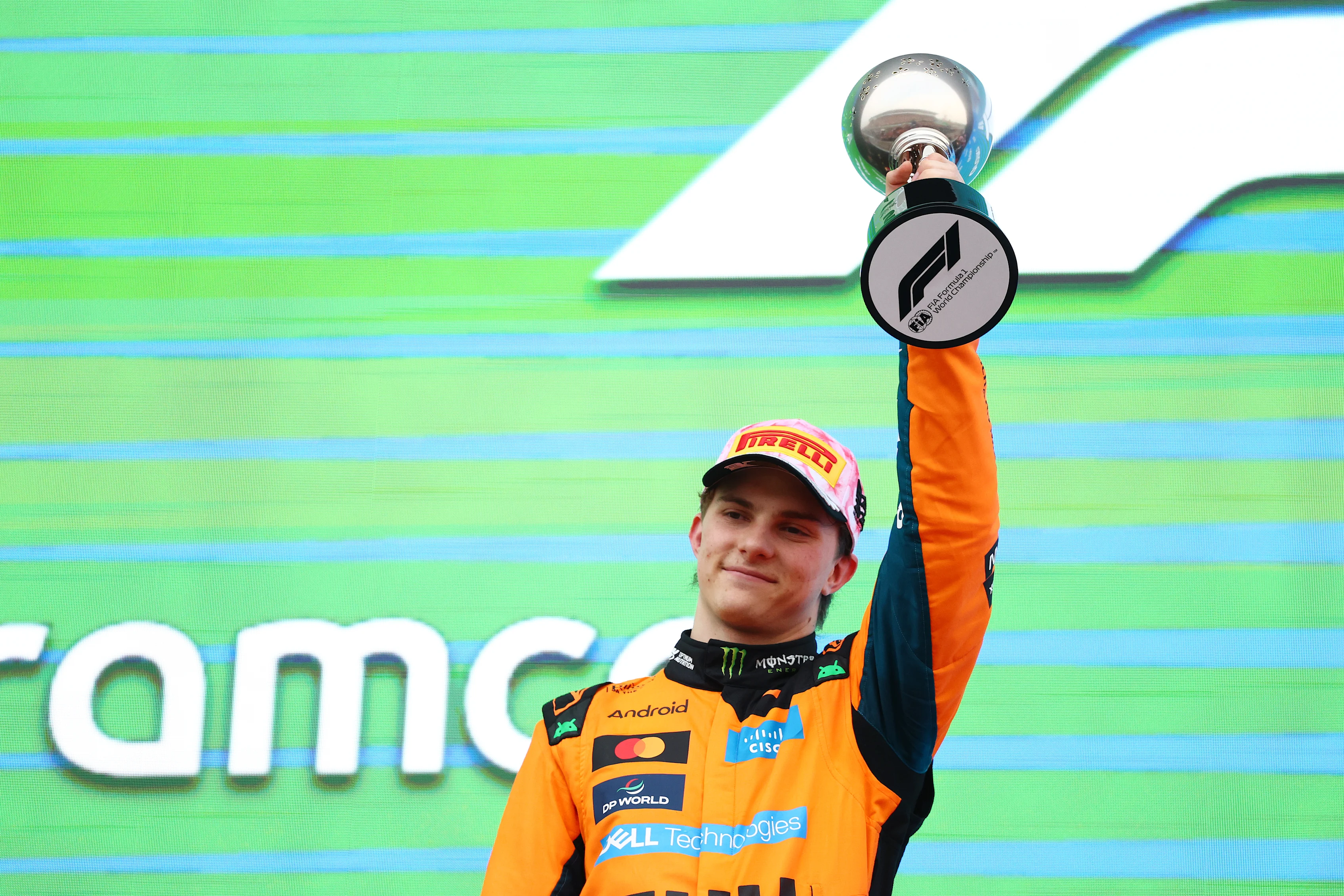 SUZUKA, JAPAN - MARCH 29: Second placed Oscar Piastri of Australia and McLaren lifts his trophy on