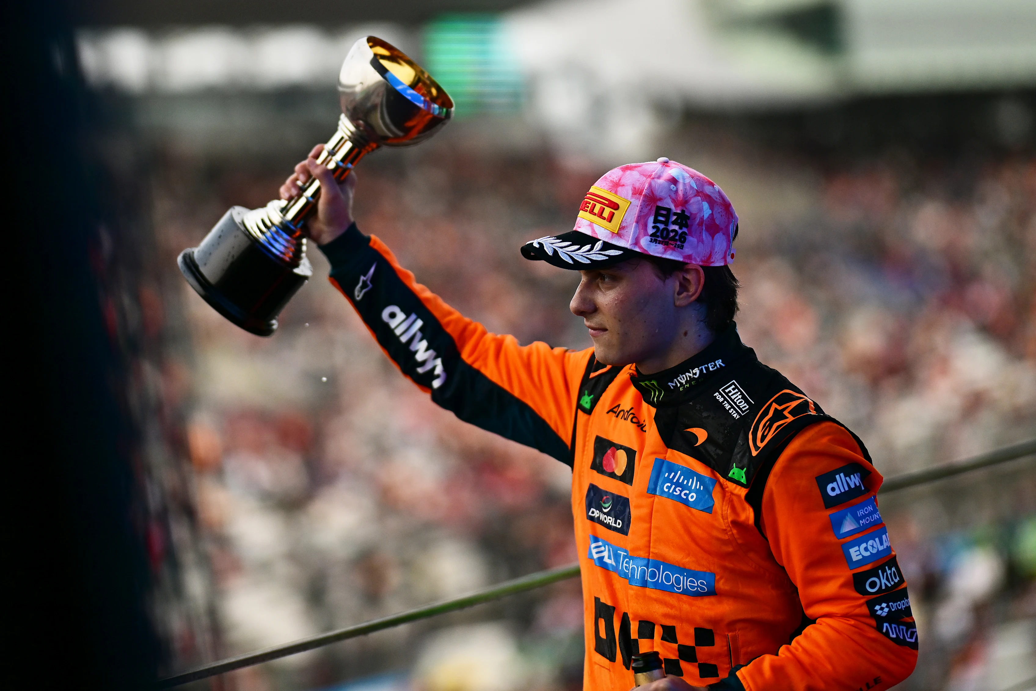 SUZUKA, JAPAN - MARCH 29: Second placed Oscar Piastri of Australia and McLaren lifts his trophy on