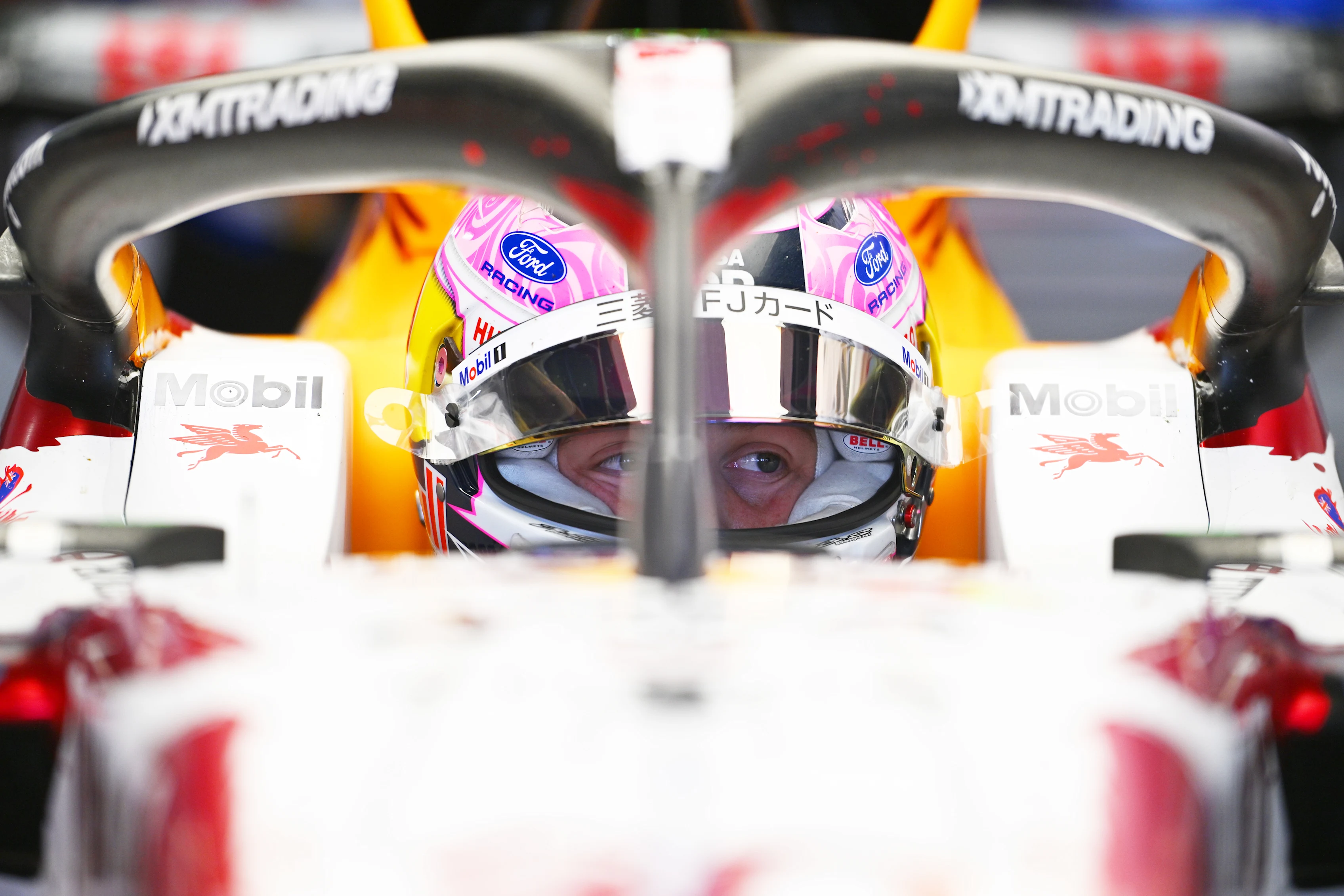 SUZUKA, JAPAN - MARCH 27: Liam Lawson of New Zealand and Visa Cash App Racing Bulls prepares to