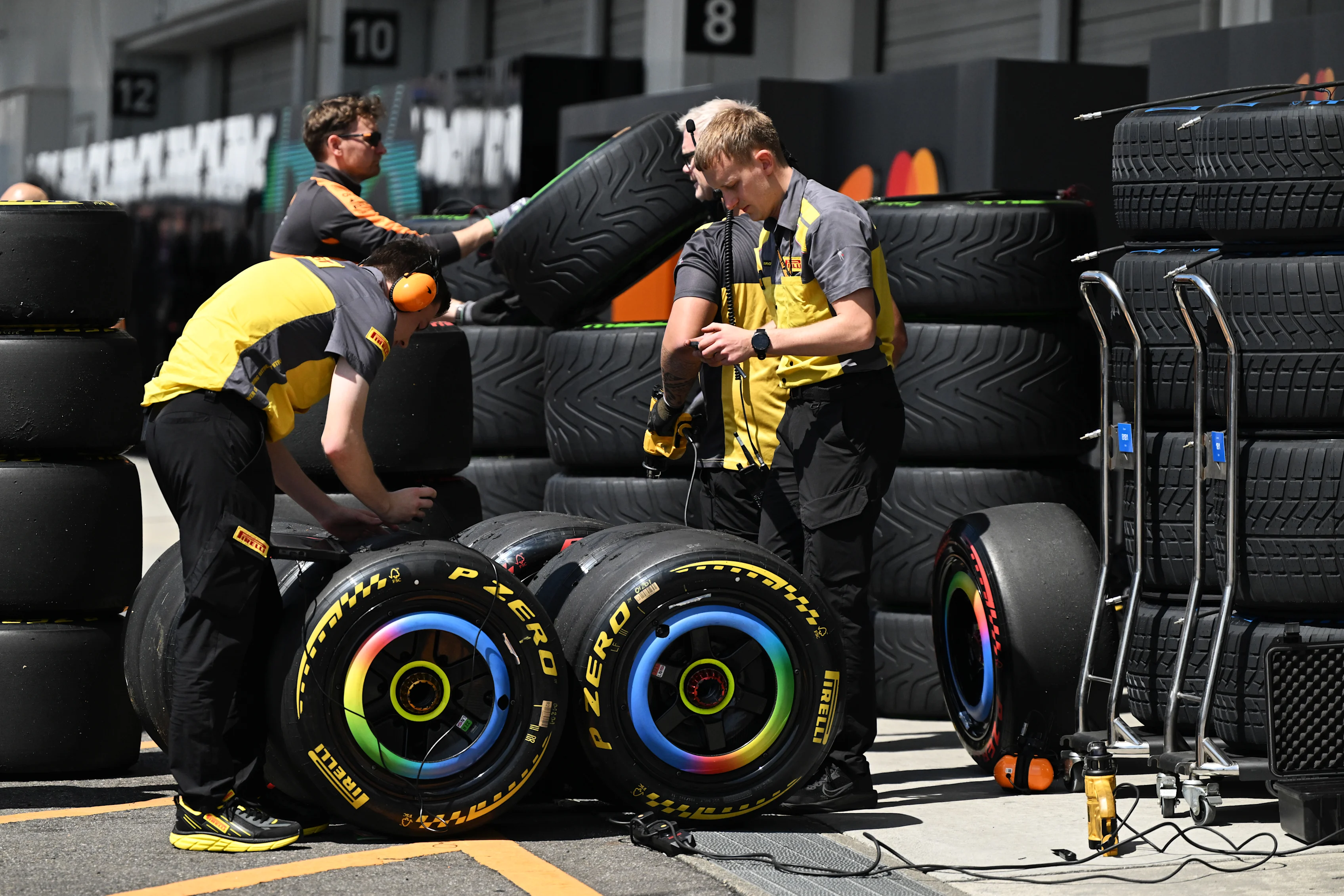 SUZUKA, JAPAN - MARCH 27: Pirelli technicians with tyres during practice ahead of the F1 Grand Prix