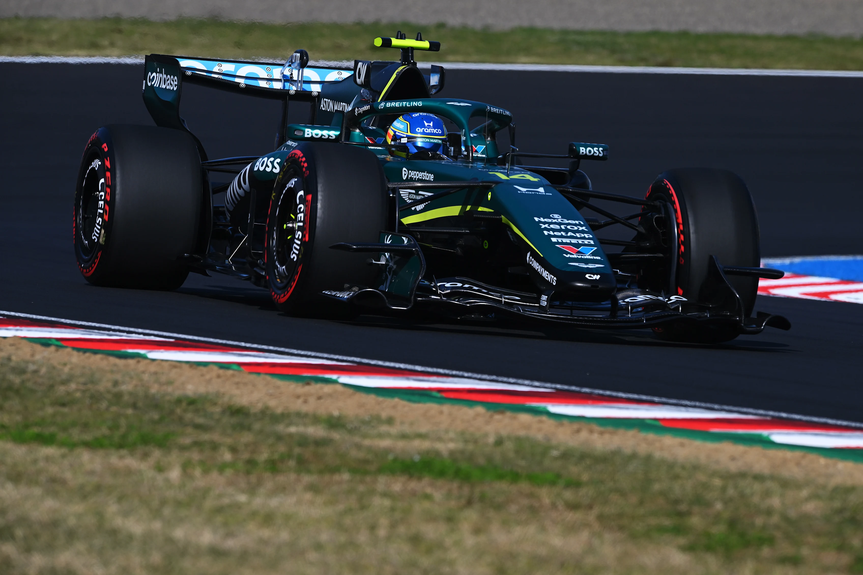 SUZUKA, JAPAN - MARCH 27: Fernando Alonso of Spain driving the (14) Aston Martin F1 Team AMR26
