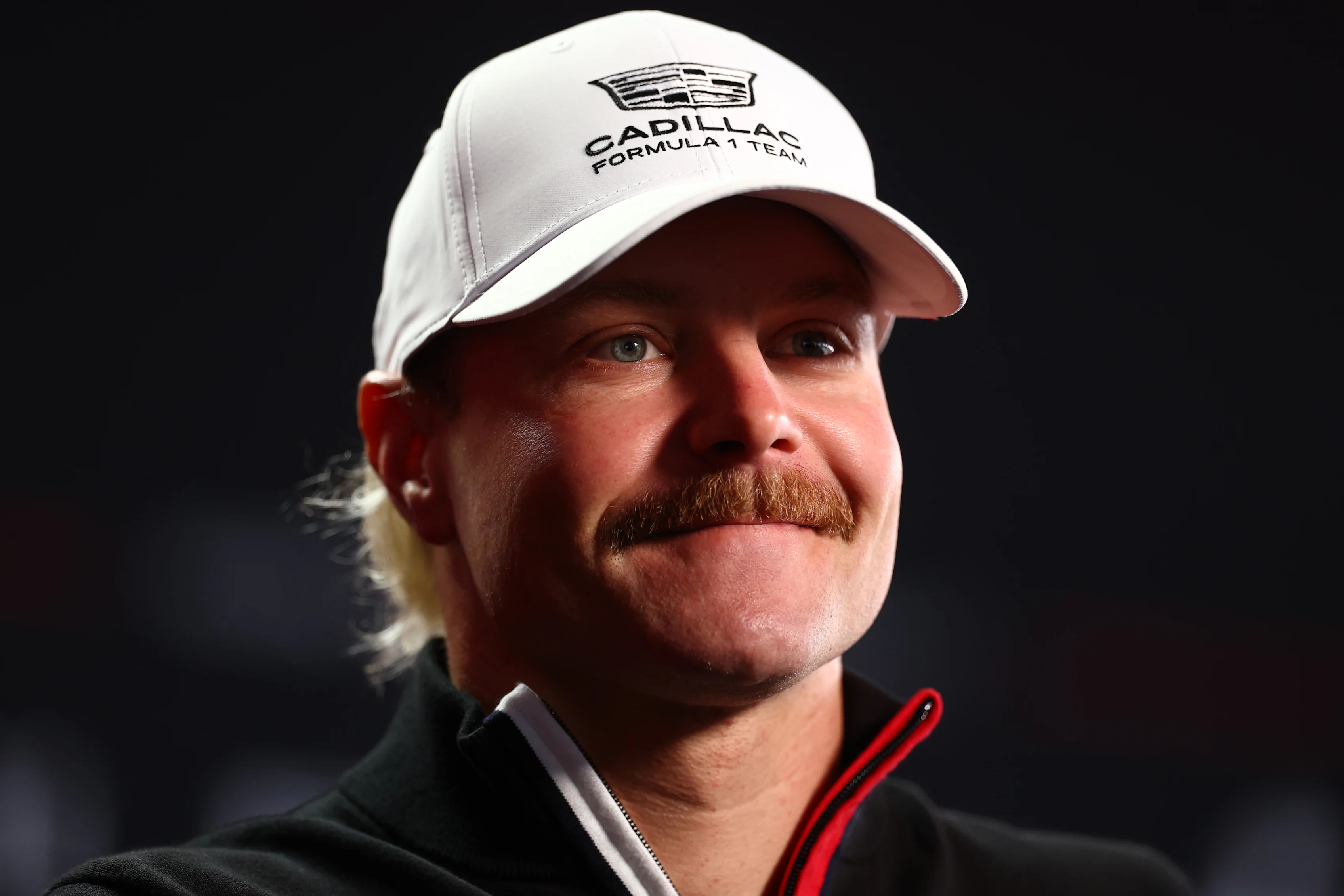 SUZUKA, JAPAN - MARCH 26: Valtteri Bottas of Finland and Cadillac F1 Team talks to the media during