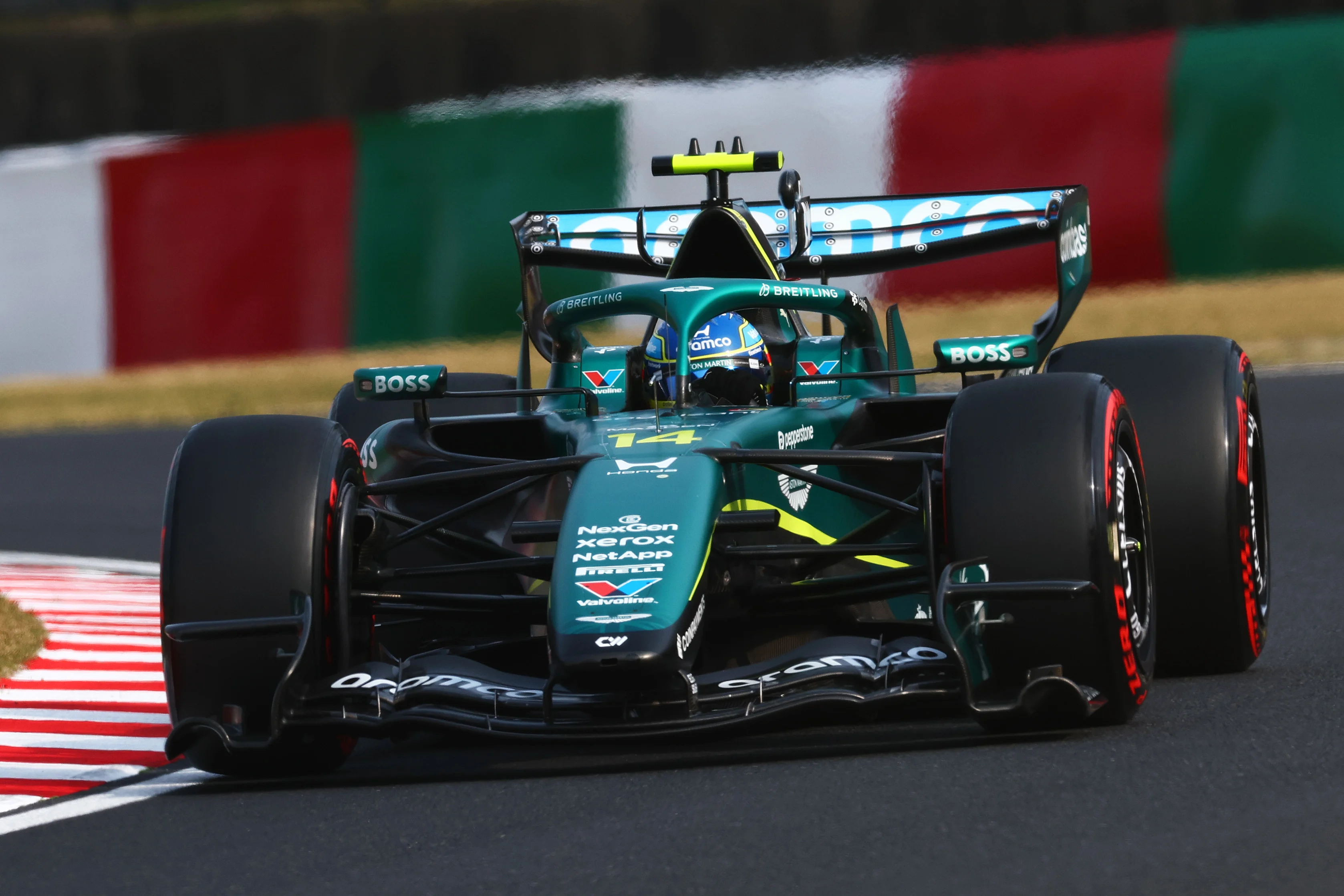 SUZUKA, JAPAN - MARCH 28: Fernando Alonso of Spain driving the (14) Aston Martin F1 Team AMR26