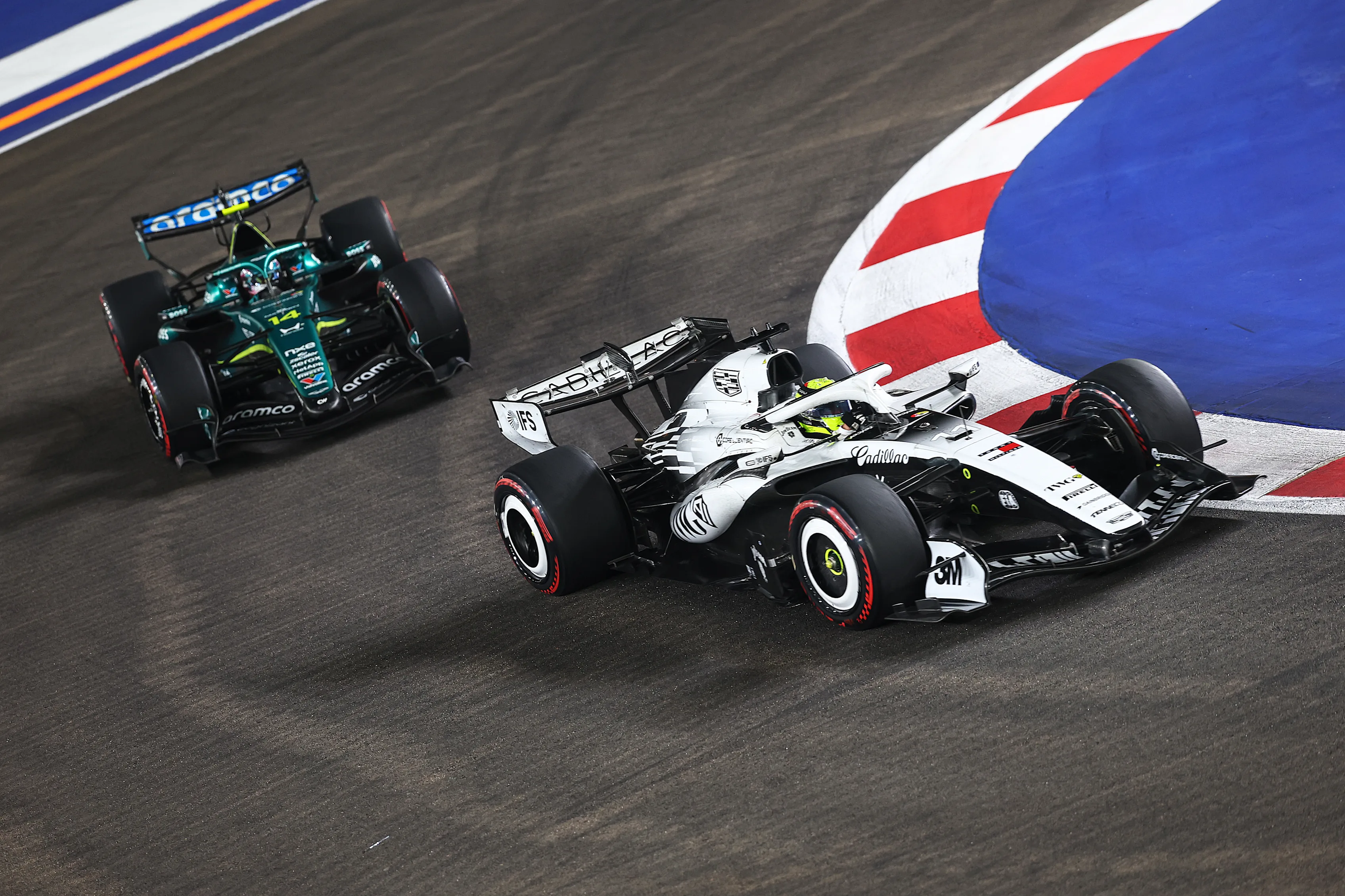 SINGAPORE, SINGAPORE - OCTOBER 11: Sergio Perez of Mexico driving the (11) Cadillac F1 Team MAC-26