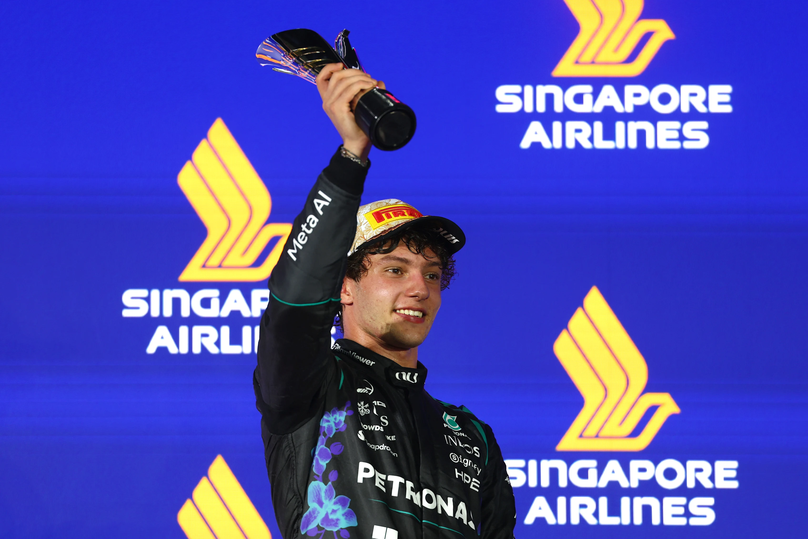 SINGAPORE, SINGAPORE - OCTOBER 11: Third placed Andrea Kimi Antonelli of Italy and Mercedes AMG