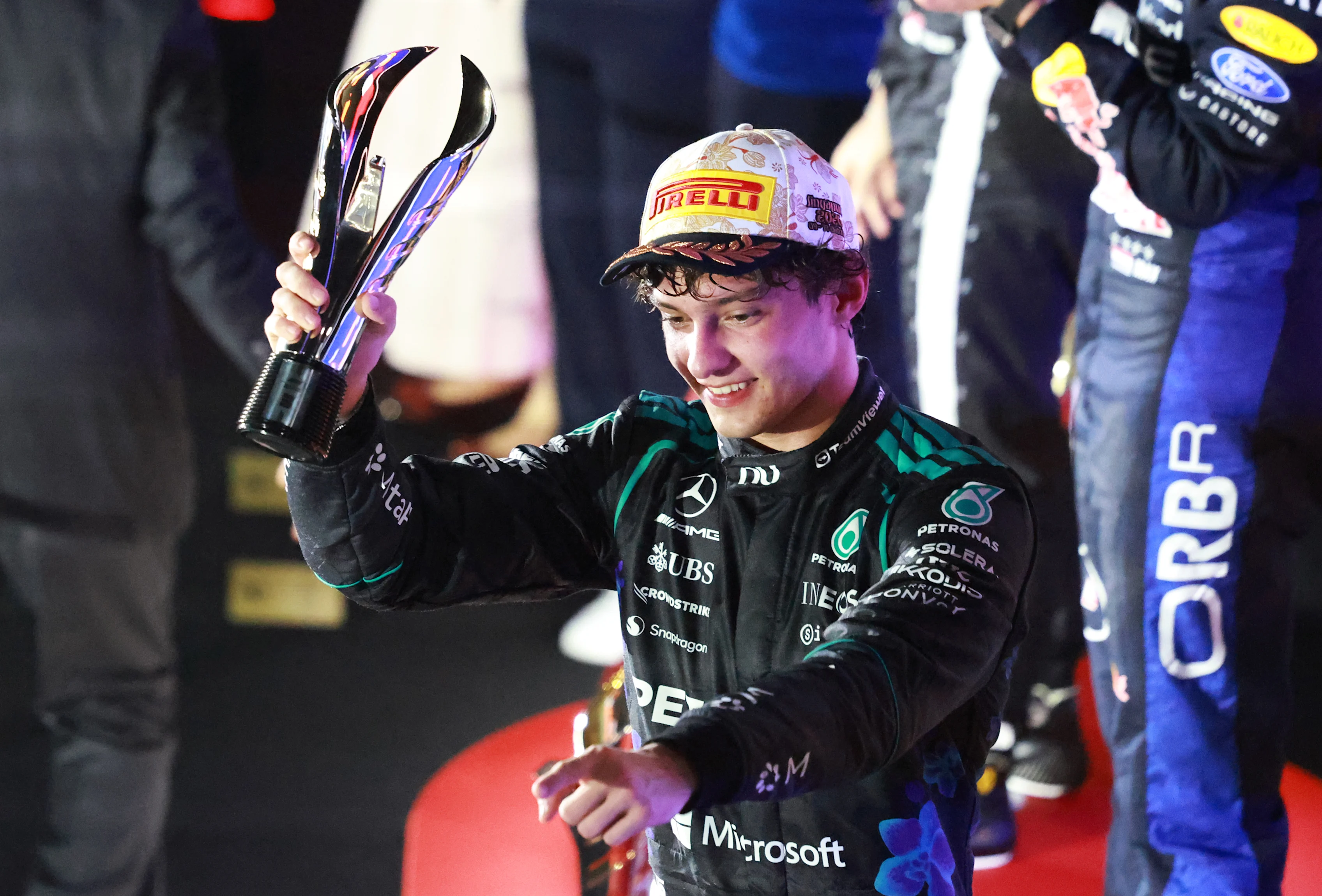 SINGAPORE, SINGAPORE - OCTOBER 11: Third placed Andrea Kimi Antonelli of Italy and Mercedes AMG